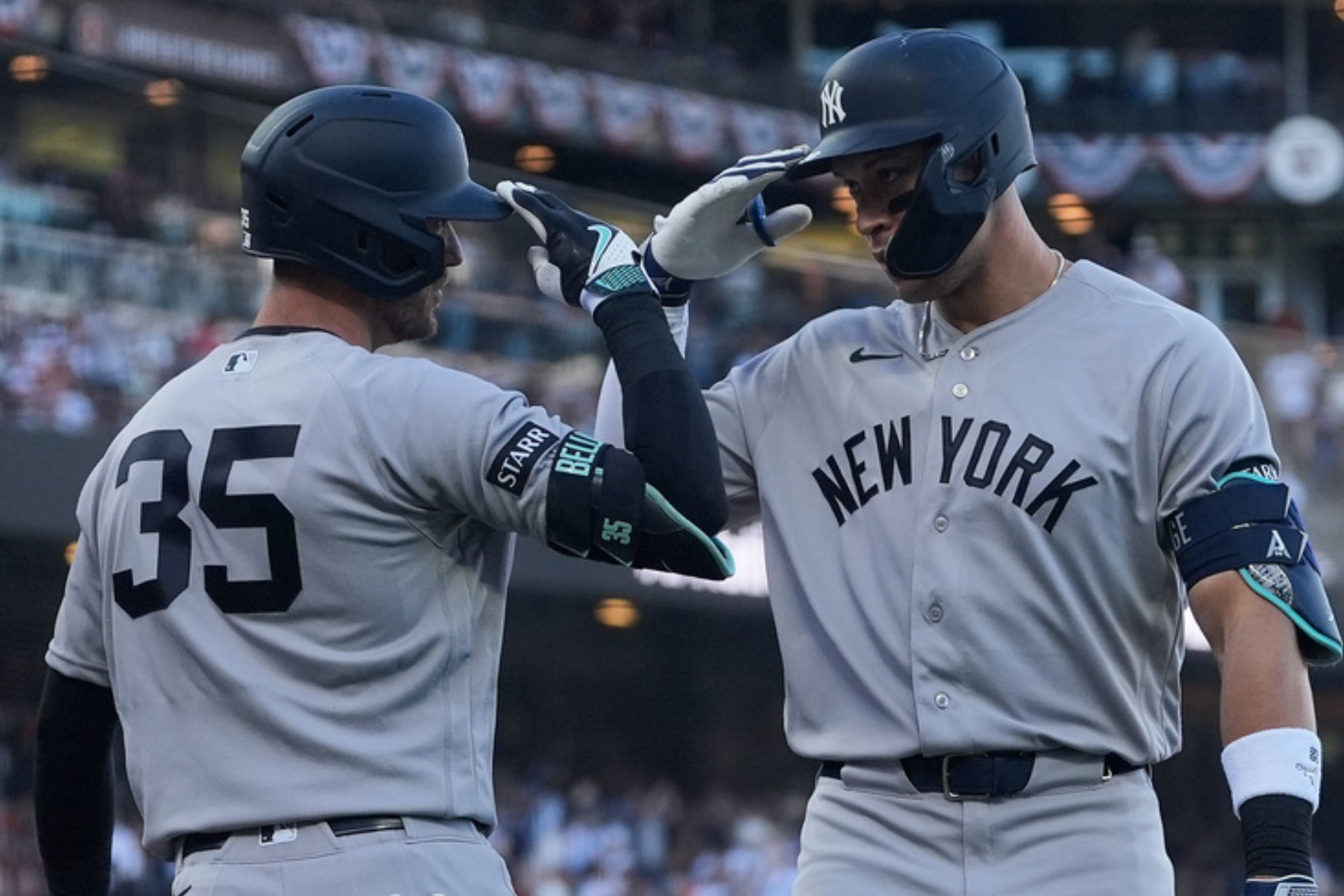 New York Yankees' Aaron Judge, right, is congratulated by Cody Bellinger (35) after hitting a home run against the San Francisco Giants during the fifth inning of a baseball game in San Francisco.