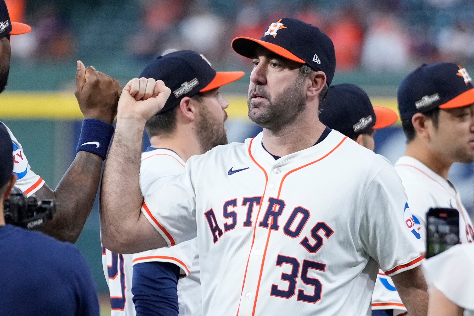 Justin Verlander celebrating a win with the rest of the Houston Astros team.