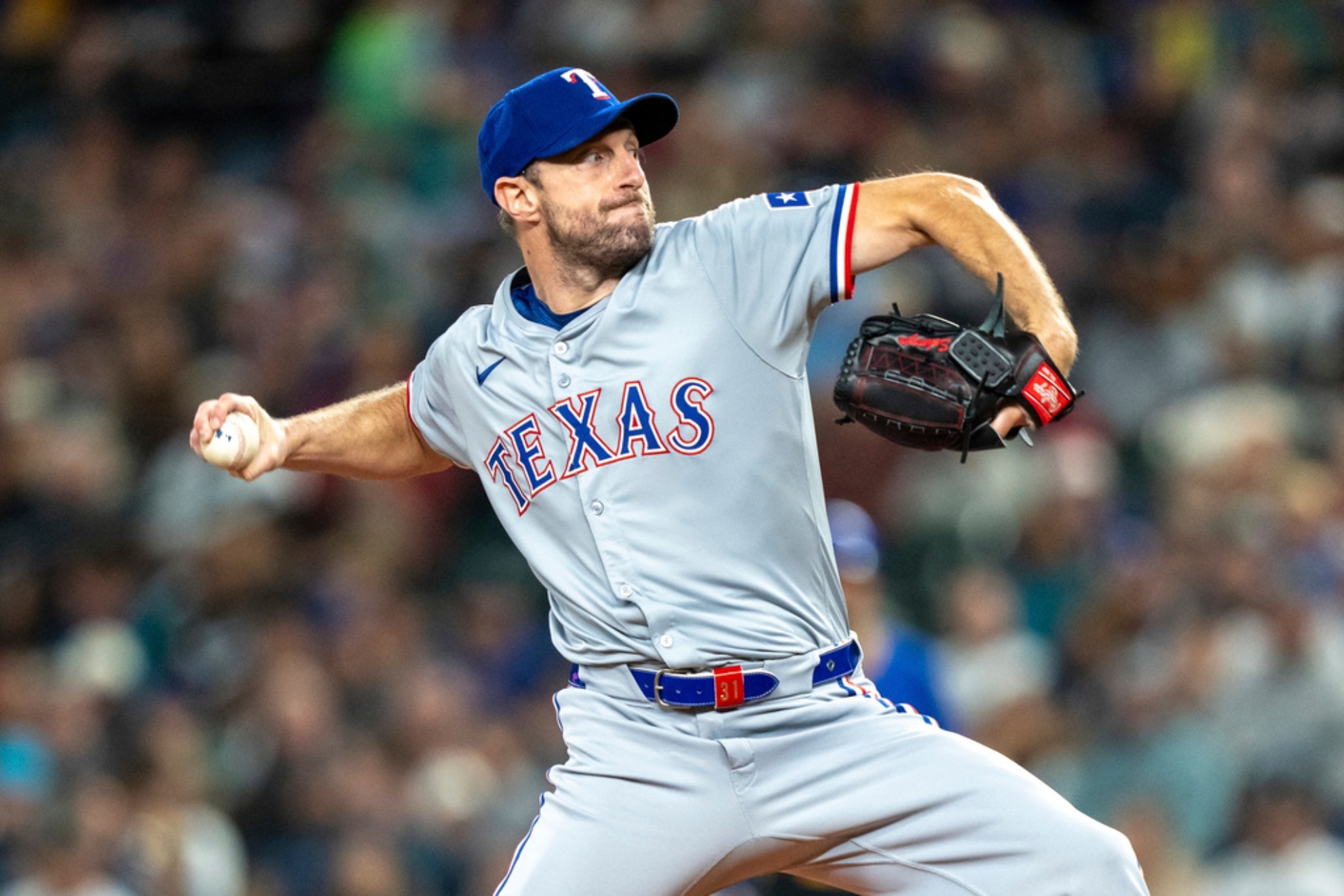 exas Rangers starter Max Scherzer delivers a pitch during a baseball game against the Seattle Mariners.