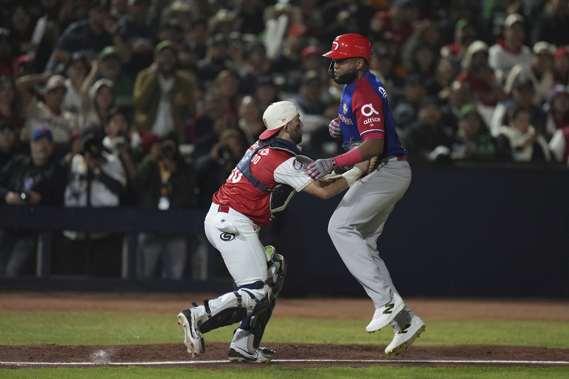 Dominican Republic's Socrates Brito, right, is tagged out by Mexico's catcher Alfredo Hurtado during a Caribbean Series baseball final game .
