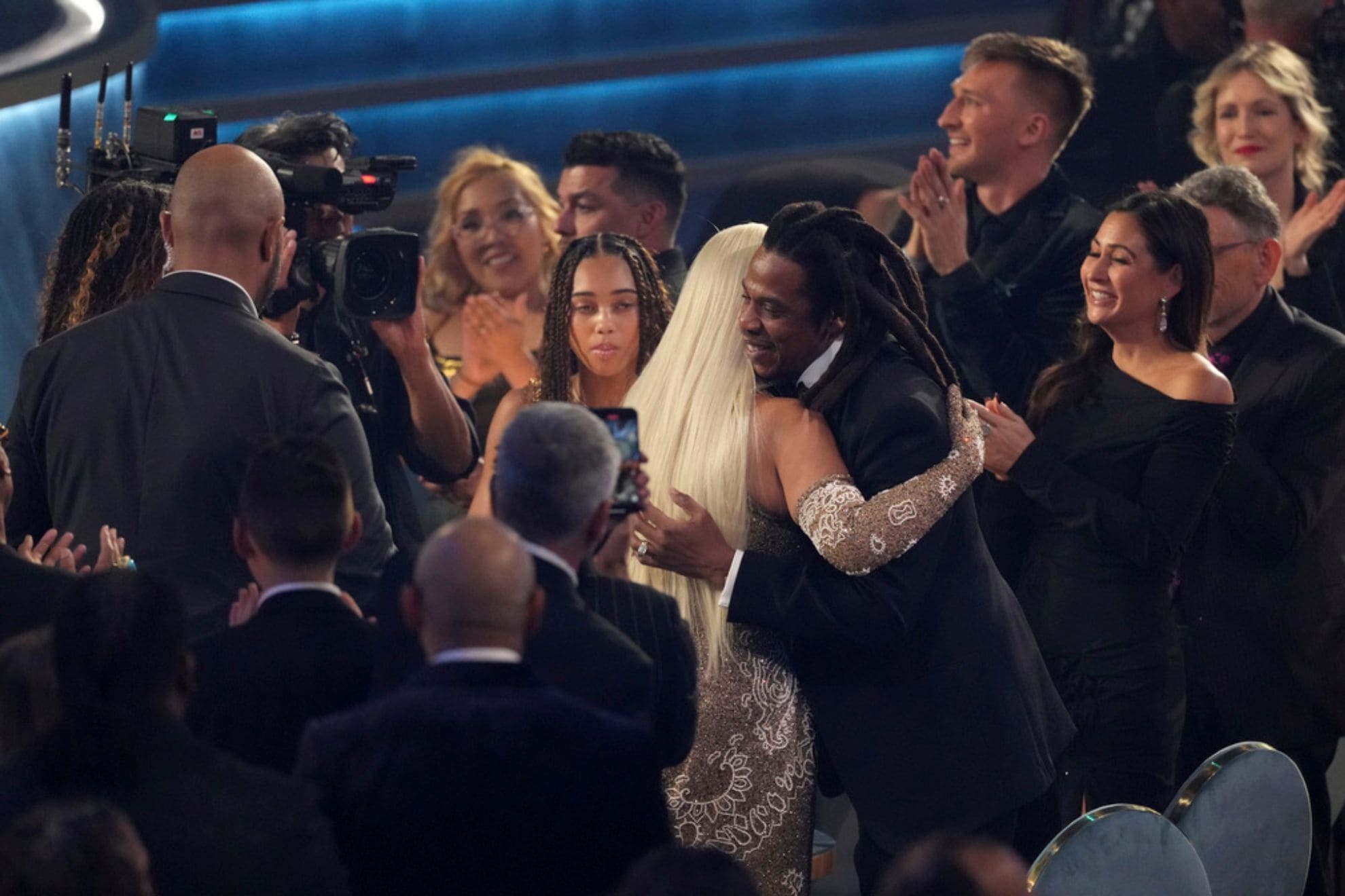 Jay-Z, right, embraces Beyonce after she wins award for album of the year for "COWBOY CARTER"the during the 67th annual Grammy Awards on Sunday, Feb. 2, 2025, in Los Angeles. (AP Photo/Chris Pizzello)