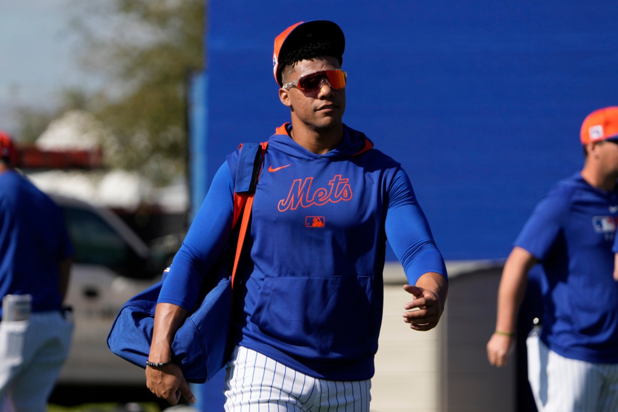 New York Mets' Juan Soto heads out for a spring training baseball practice.