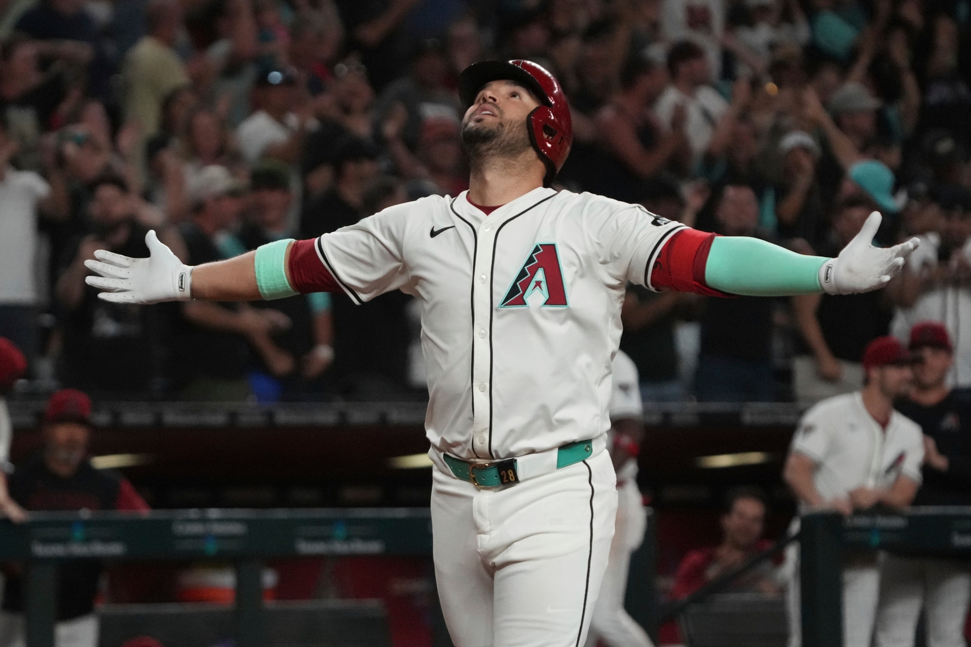 Eugenio Suárez reacts after hitting a solo home run against the Atlanta Braves.