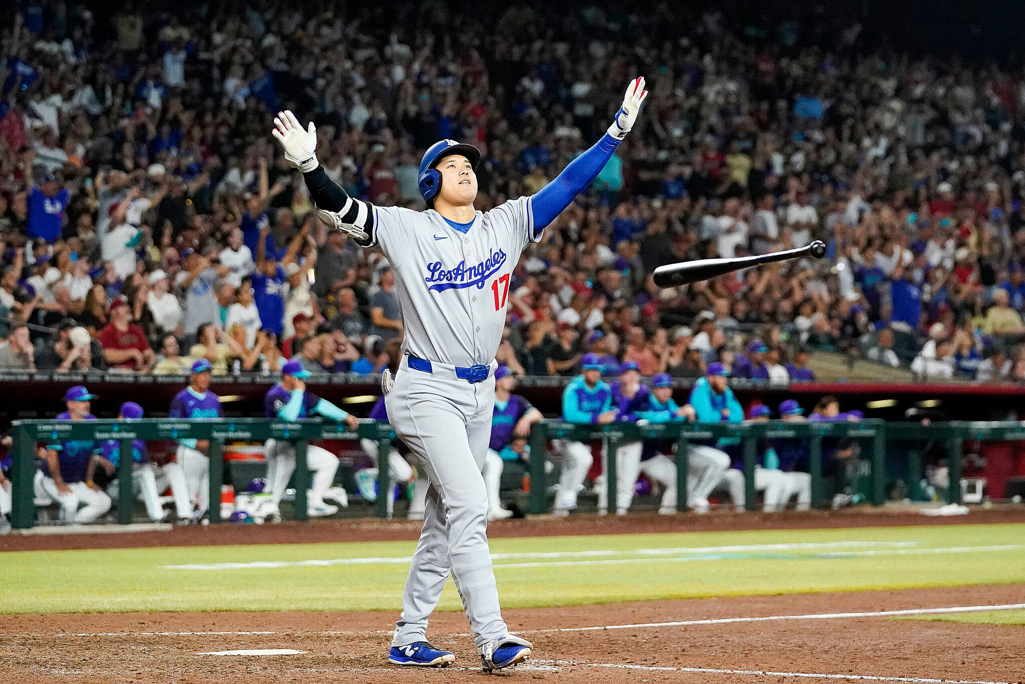 Los Angeles Dodgers' Shohei Ohtani celebrates a three run home run against for the Arizona Diamondbacks during the ninth inning