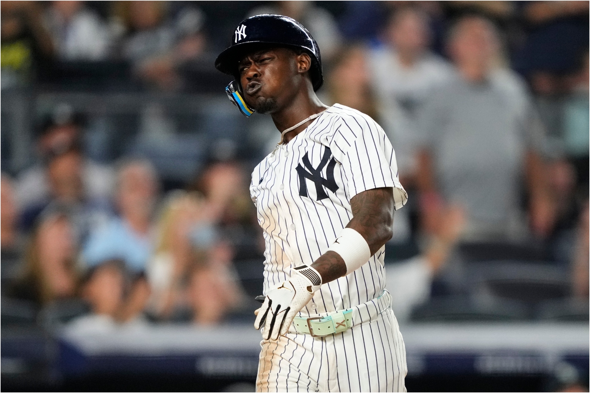 New York Yankees' Jazz Chisholm Jr. reacts after hitting a fly.