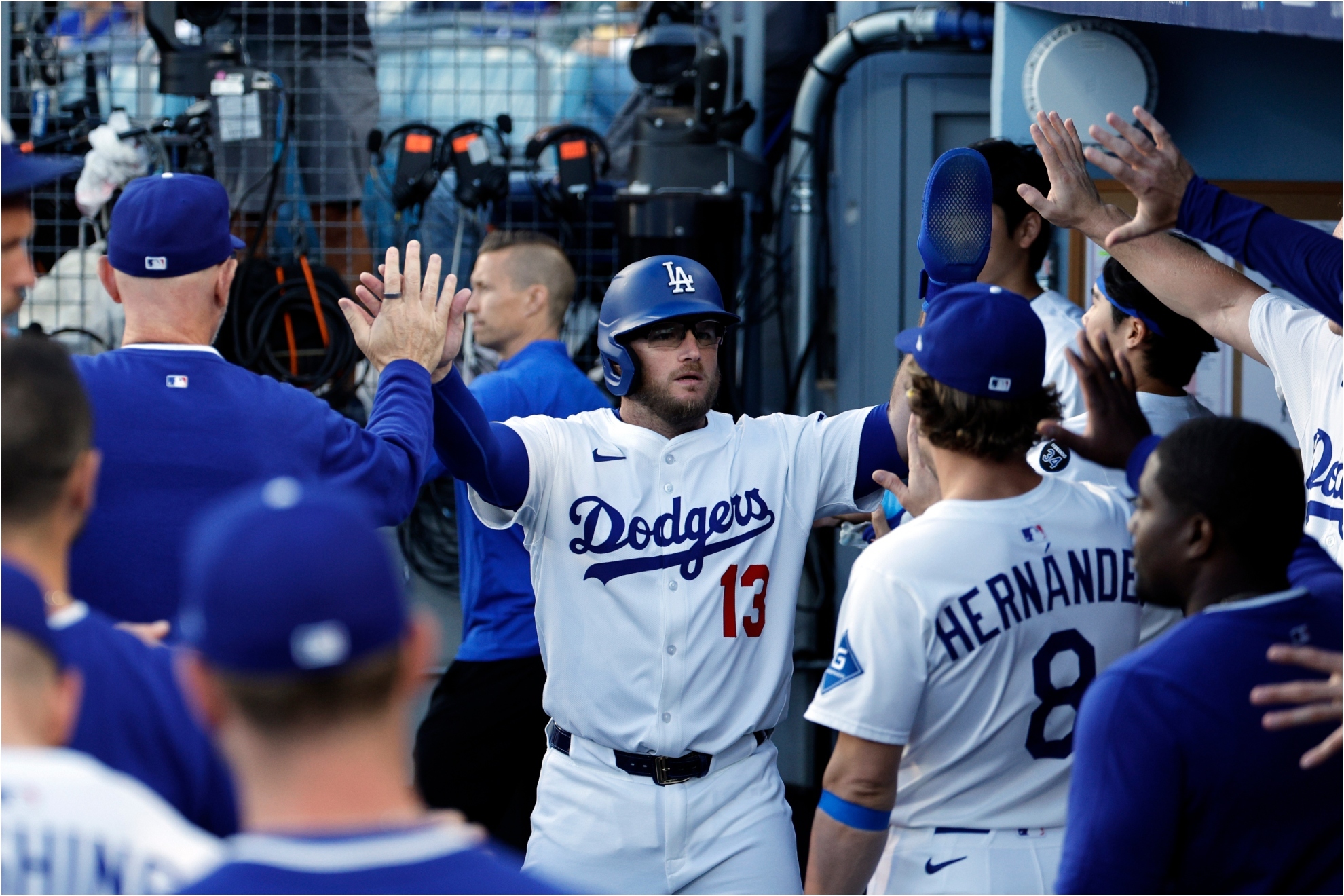 Los Angeles Dodgers' Max Muncy is congratulated after scoring a run.