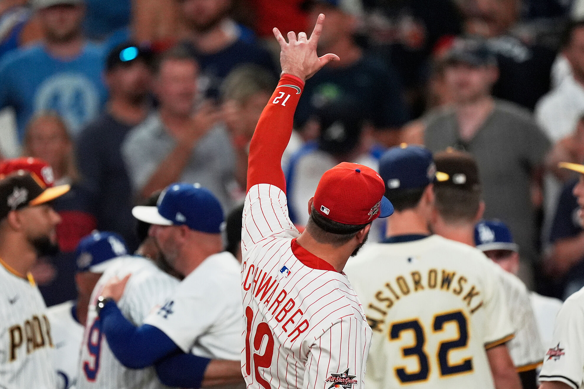 Philadelphia Phillies lt;HIT gt;Kyle lt;/HIT gt; lt;HIT gt;Schwarber lt;/HIT gt; celebrates after winning the tiebreaker at the MLB baseball All-Star game between the American League and National League, Tuesday, July 15, 2025, in Atlanta. (AP Photo/Mike Stewart)