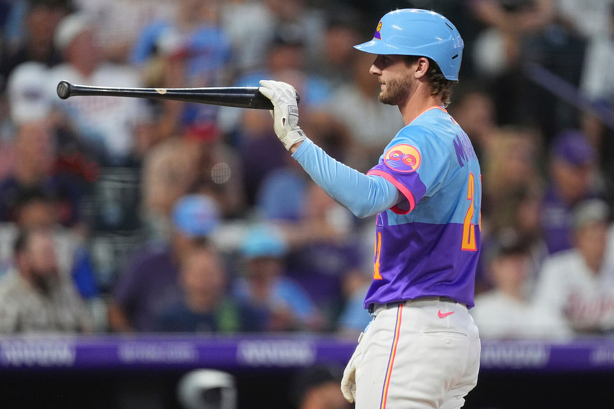 Colorado Rockies' Ryan McMahon reacts after striking out with the bases loaded against Minnesota Twins relief pitcher Cole Sands to end the sixth inning of a baseball game Friday, July 18, 2025, in Denver.