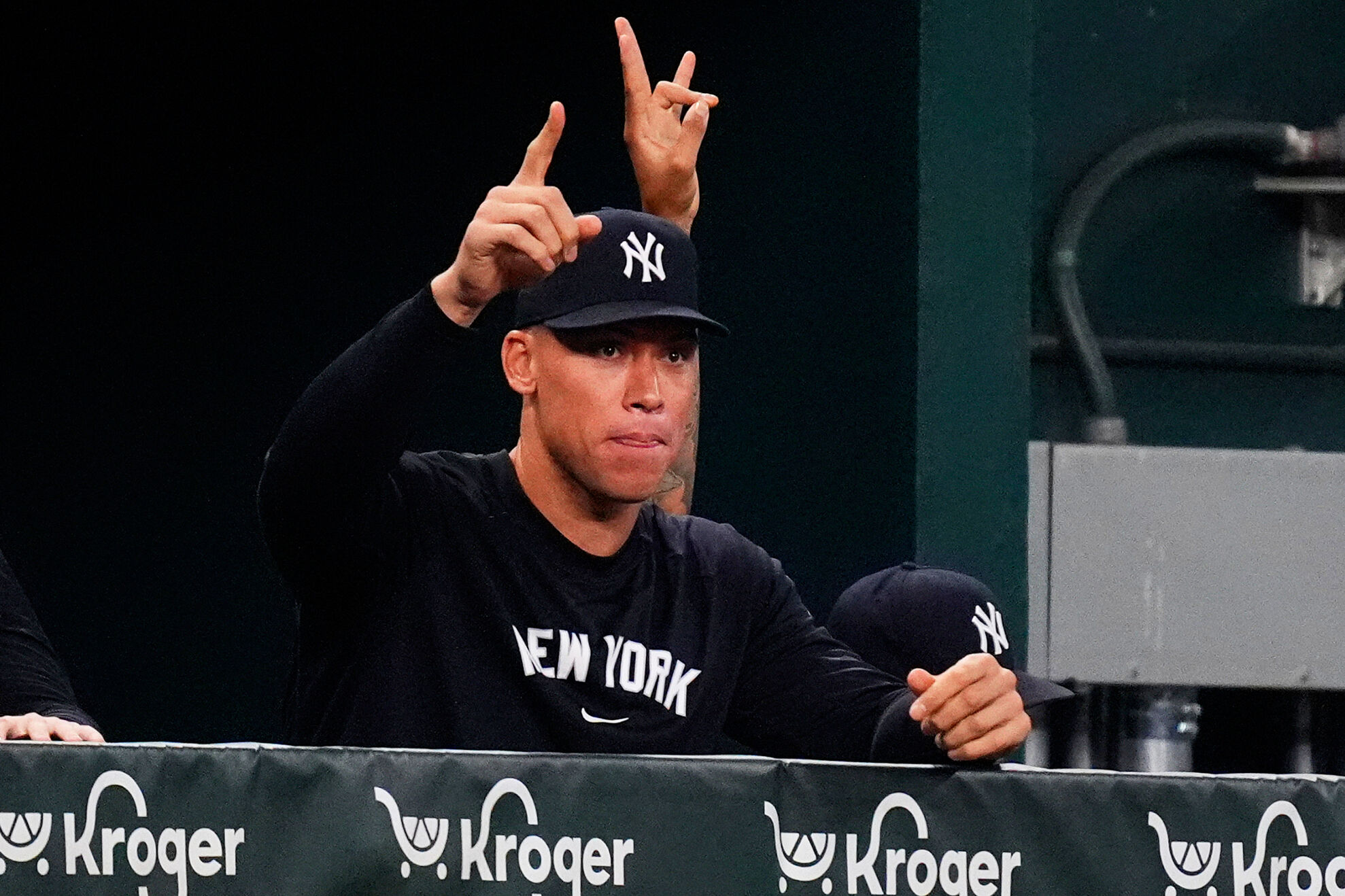 New York Yankees Aaron Judge gestures in the dugout during the second inning of a baseball game against the Texas Rangers, Monday, Aug. 4, 2025, in Arlington, Texas.