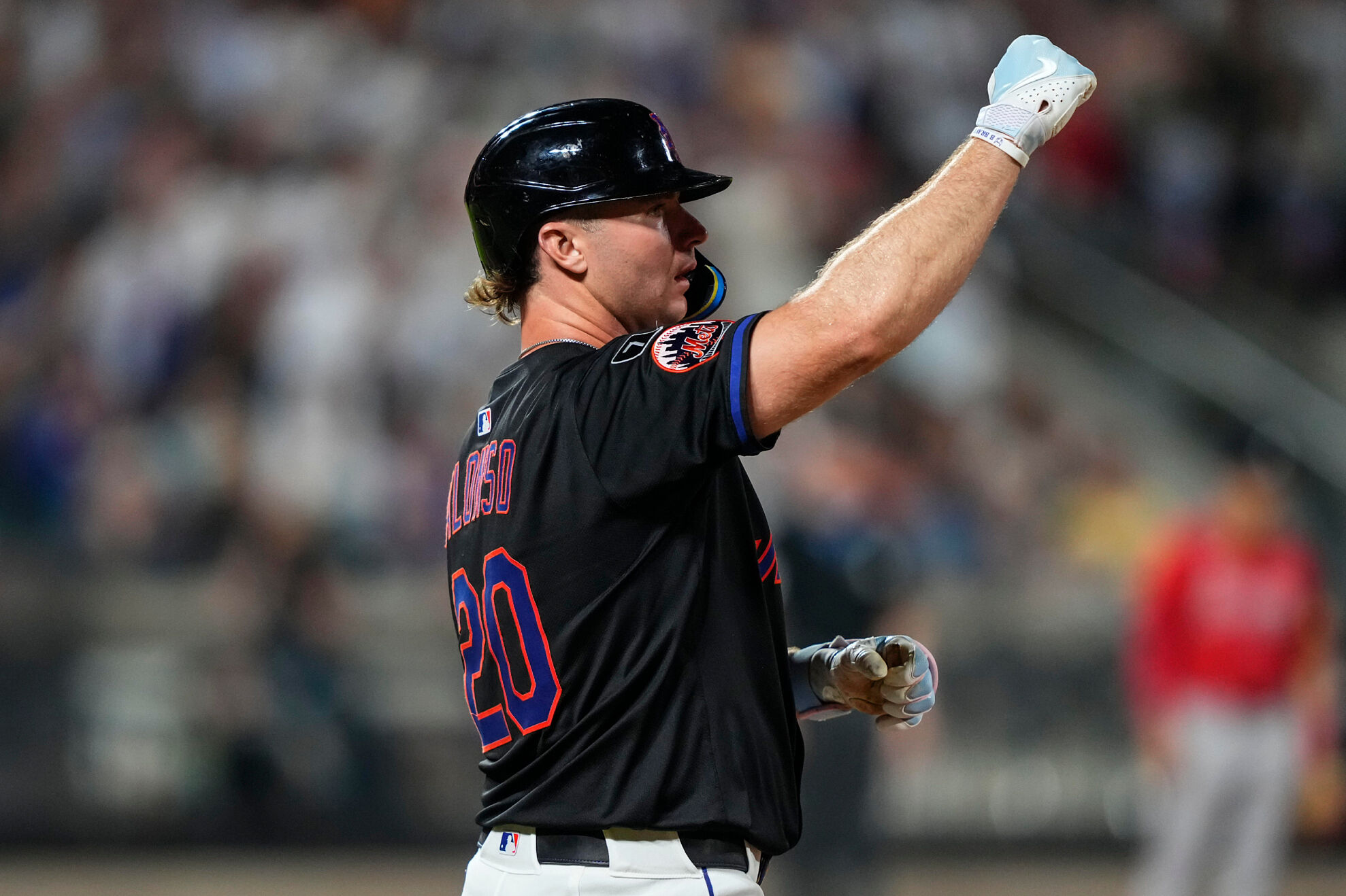 New York Mets' Pete Alonso celebrates after hitting an RBI single during the sixth inning of a baseball game against the Atlanta Braves, Thursday, Aug. 14, 2025, in New York.