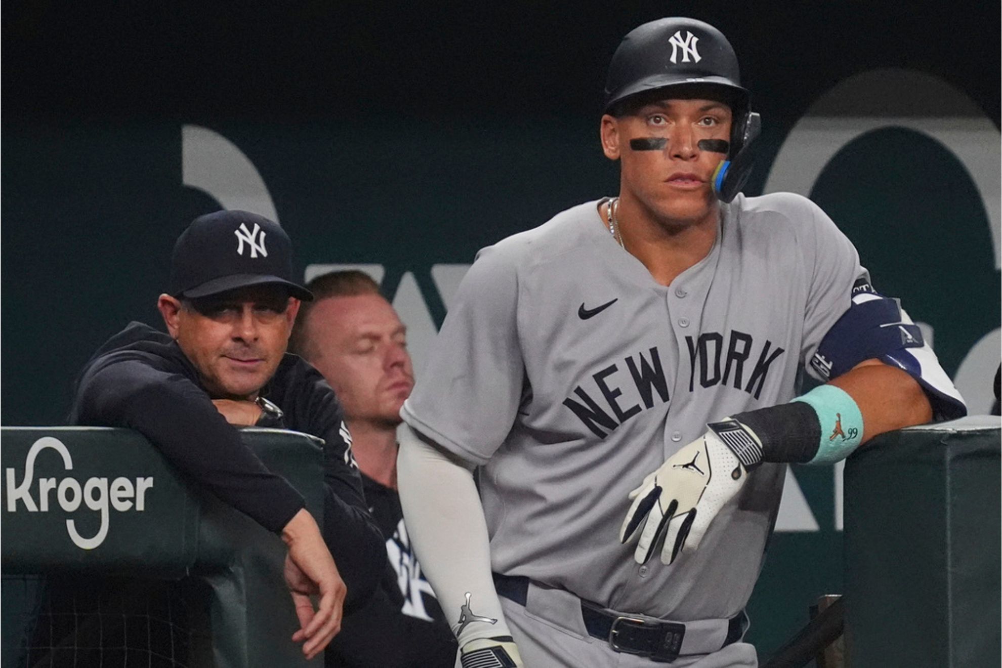 New York Yankees' Aaron Judge and manager Aaron Boone look on from the dugout during the sixth inning of a baseball game against the Texas Rangers