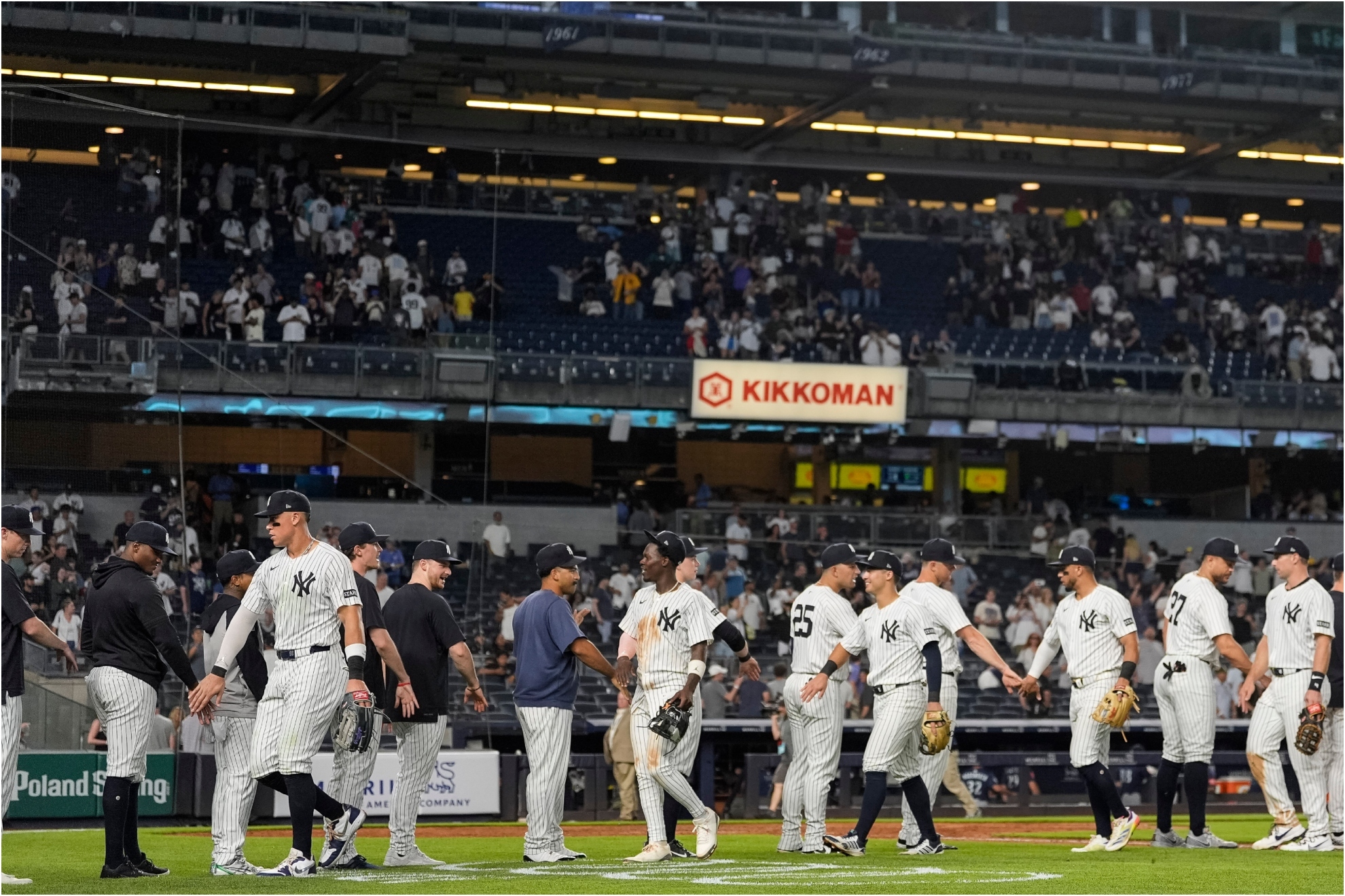 New York Yankees players celebrate the team's win.