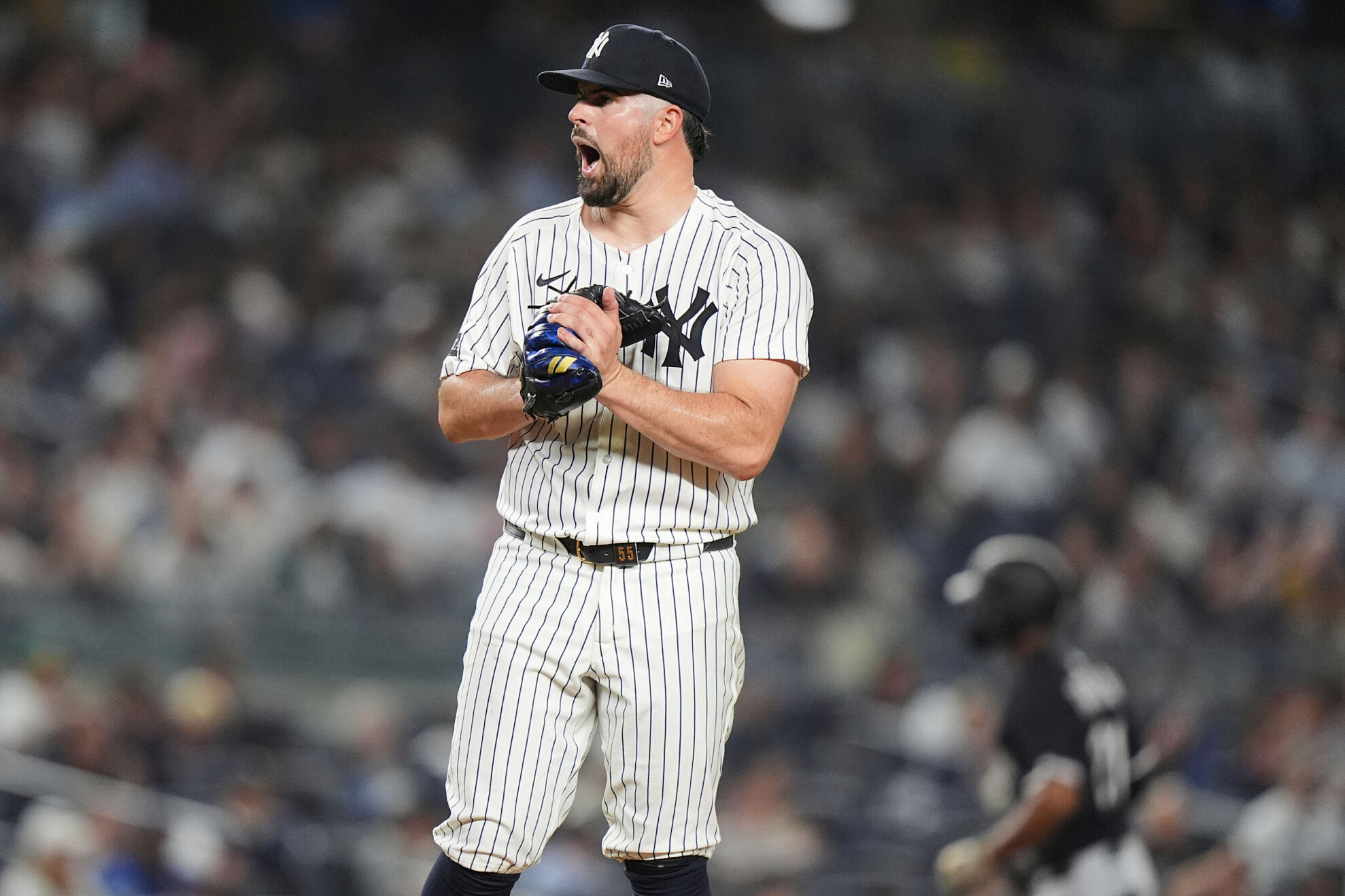New York Yankees pitcher Carlos Rodón reacts as Chicago White Sox's Michael A. Taylor runs the bases after hitting a home run during the fourth inning of a baseball game Thursday, Sept. 25, 2025, in New York.