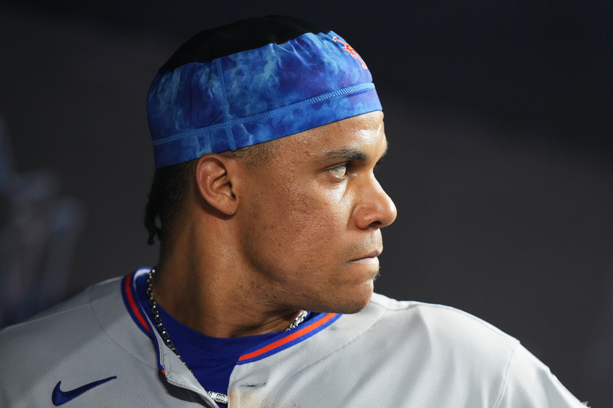 New York Mets right fielder Juan Soto looks from the dugout during the eighth inning of a baseball game against the Miami Marlins, Friday, Sept. 26, 2025, in Miami.
