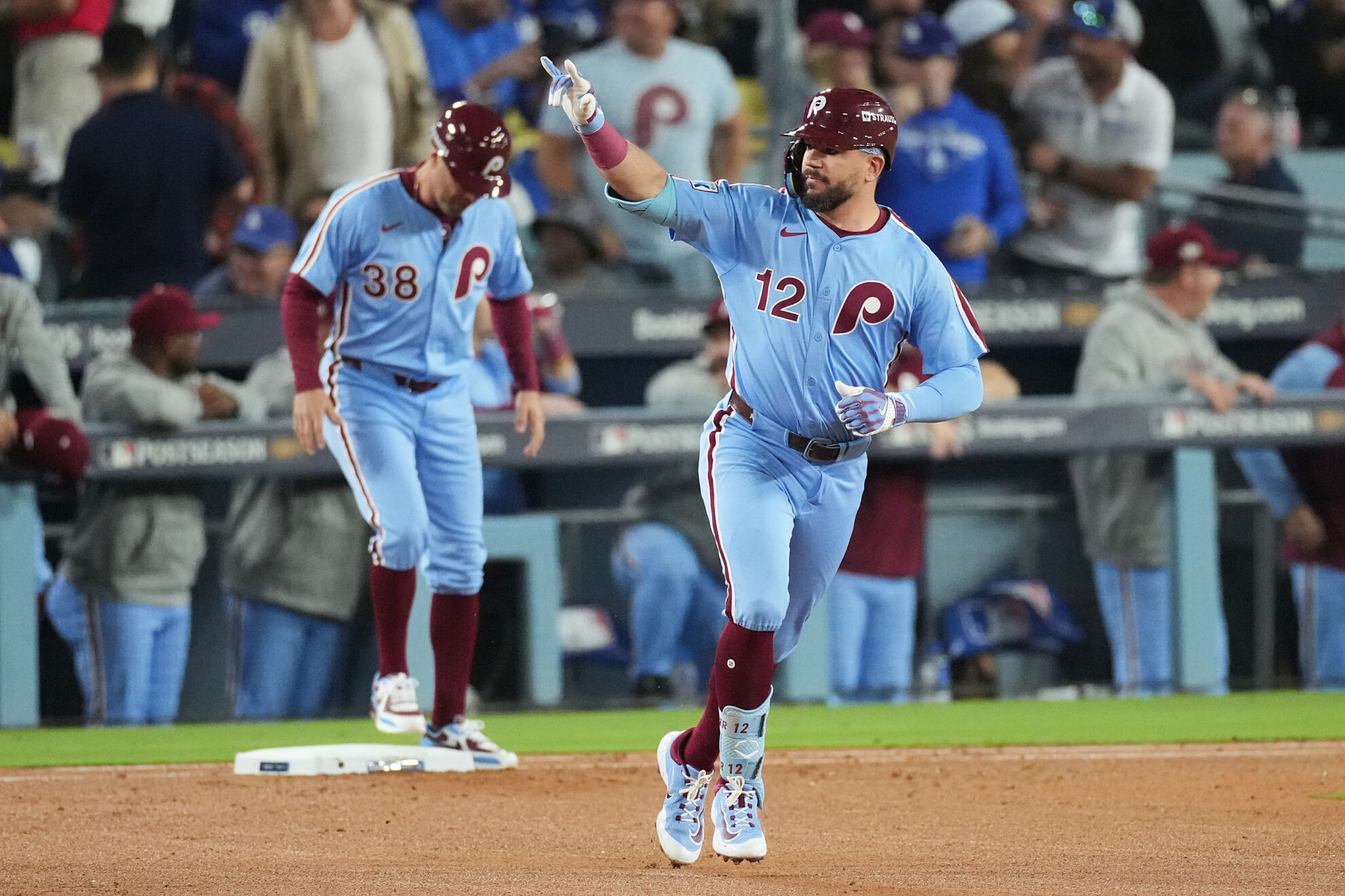 Kyle Schwarber celebrates one of his home runs against the Dodgers in Game 3 of the National League Division Series.