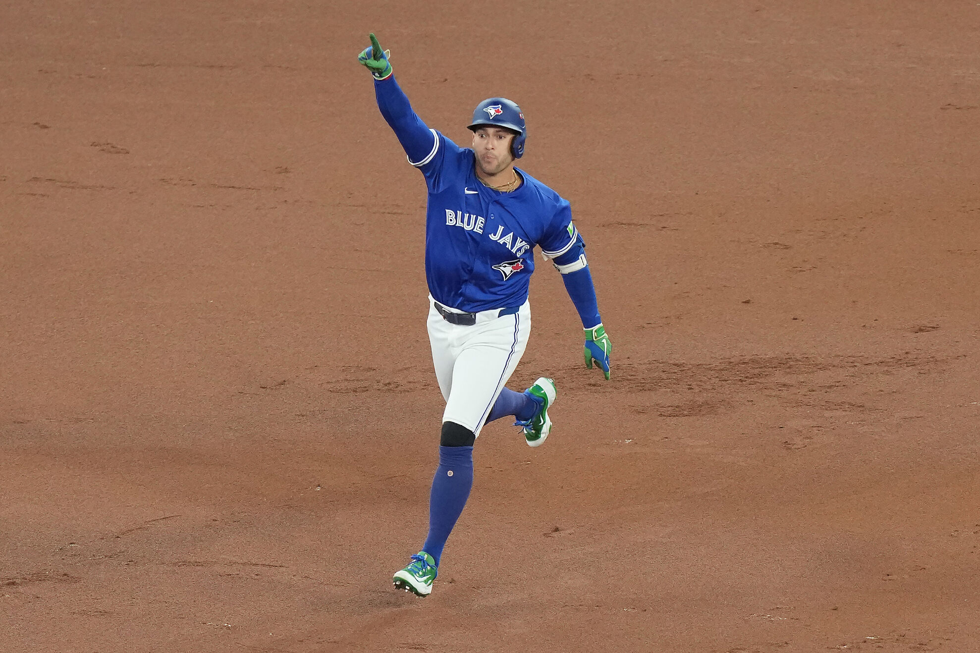 Toronto Blue Jays' George Springer rounds the bases after hitting a solo home run against the Seattle Mariners during the first inning in Game 1 of baseball's American League Championship Series in Toronto, Sunday, Oct. 12, 2025.