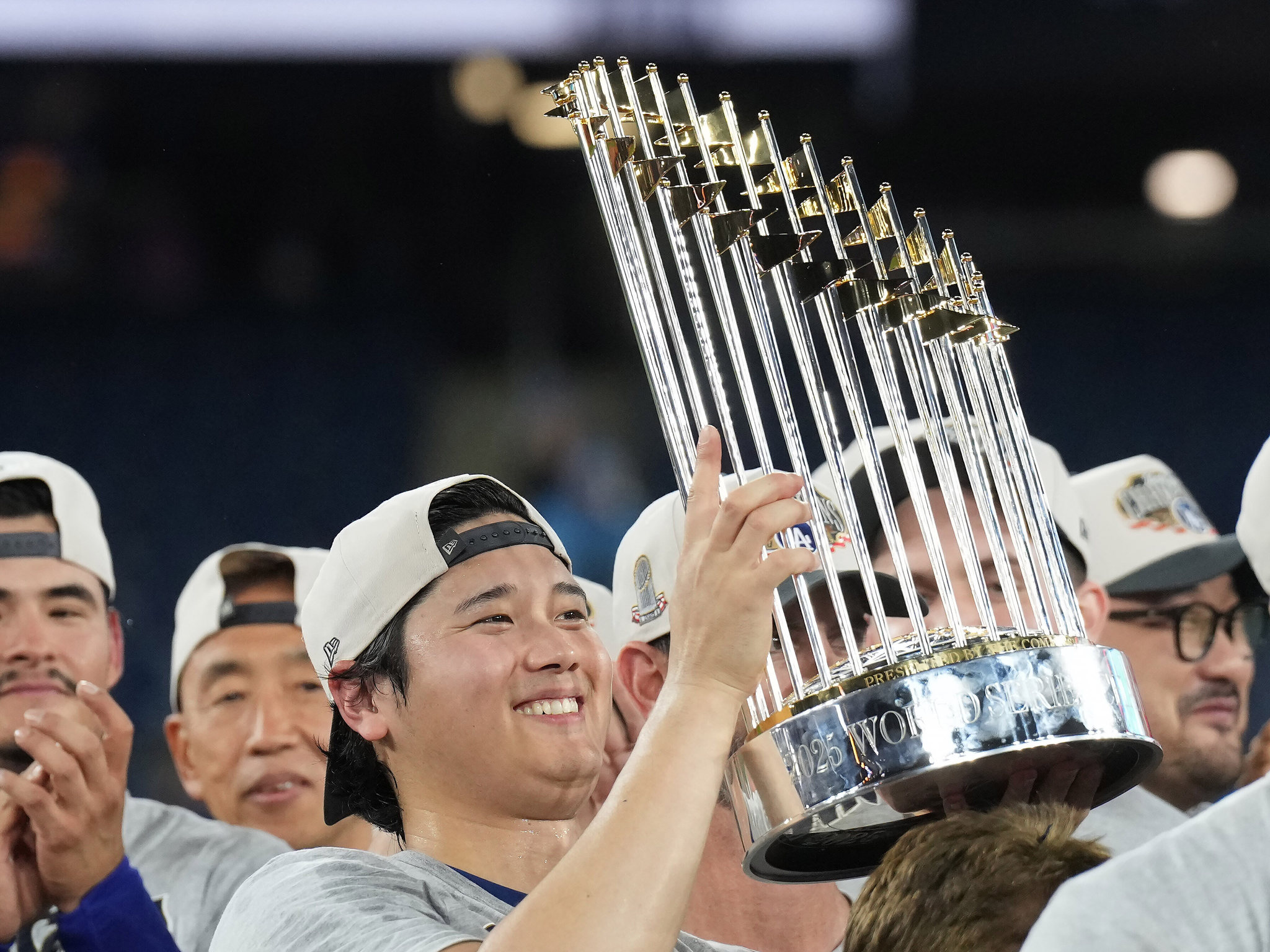 Los Angeles Dodgers pitcher Shohei Ohtani lifts the Commissioner's Trophy after winning the 2025 World Series