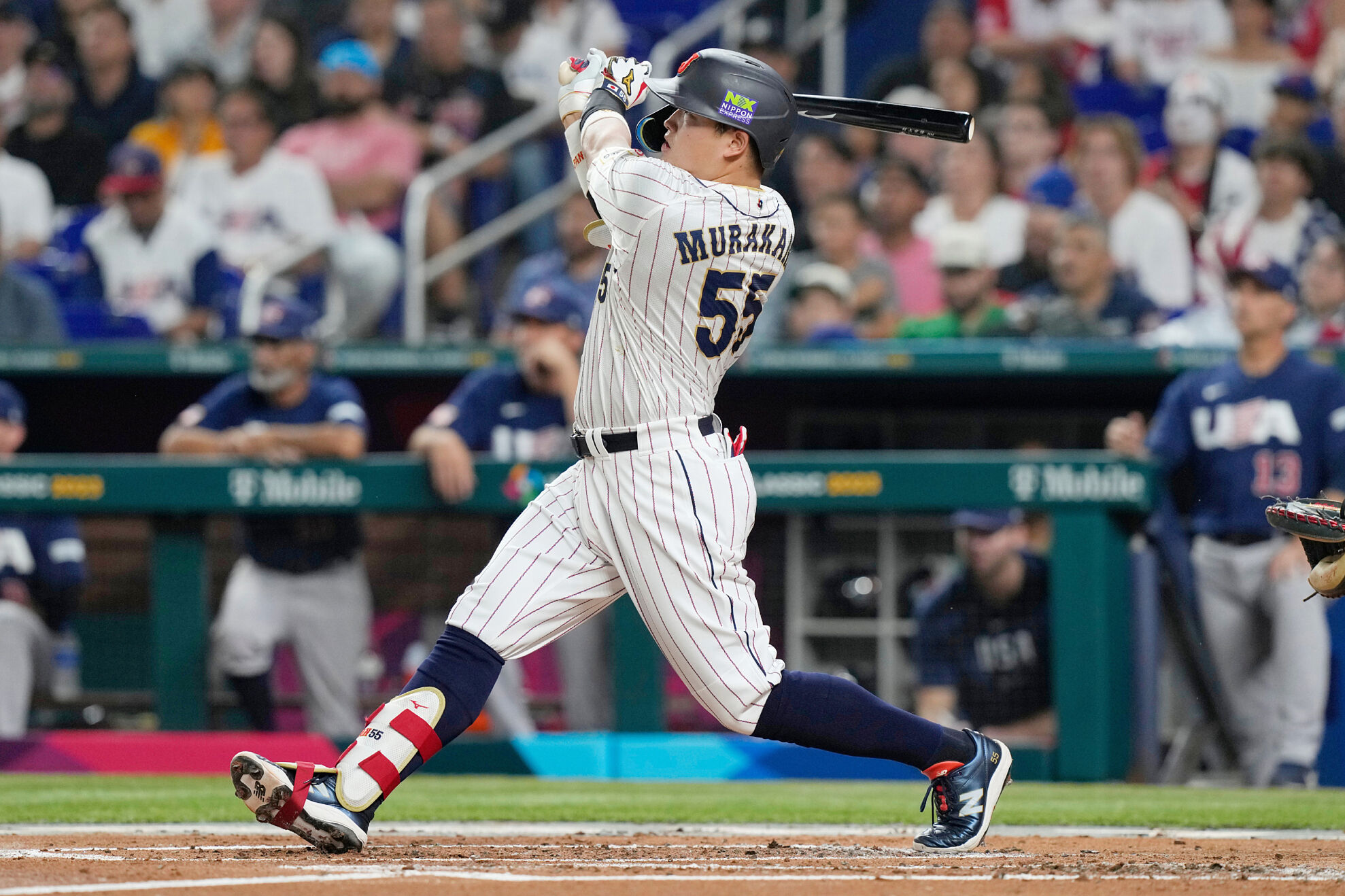 Japan's Munetaka Murakami (55) hits a home run during the second inning a World Baseball Classic game against the United States, Tuesday, March 21, 2023, in Miami.