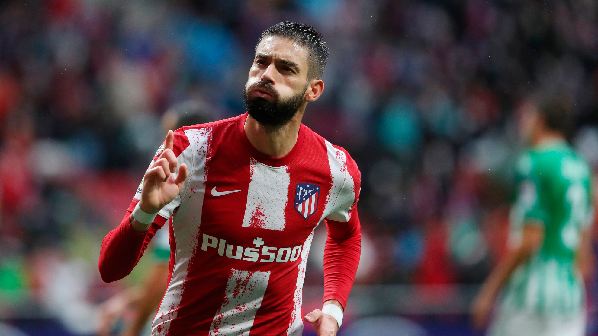 Yannick Carrasco celebrates a goal for Atletico Madrid.