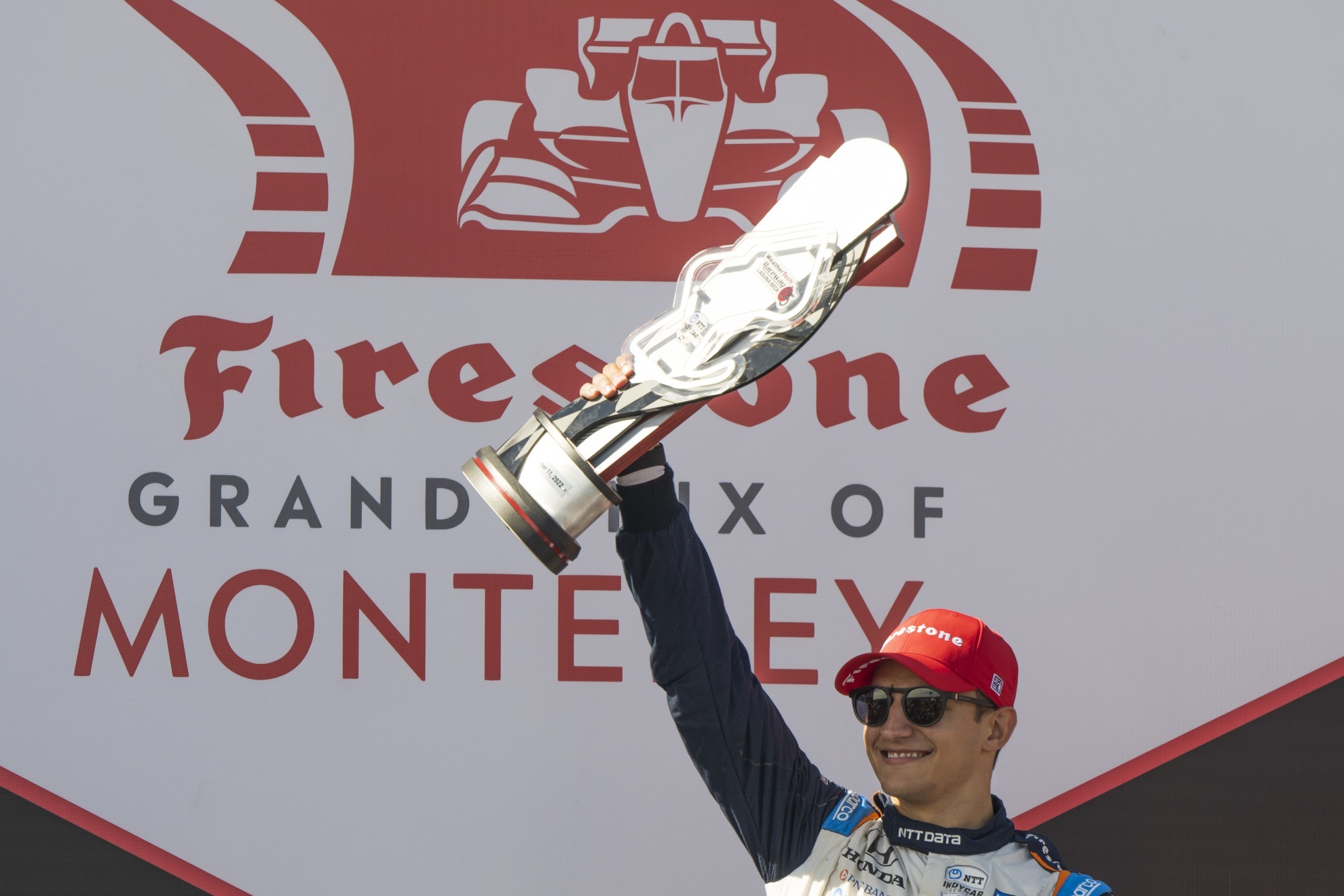 Alex Palou celebrates after winning the IndyCar season finale auto race at Laguna Seca Raceway. | AP