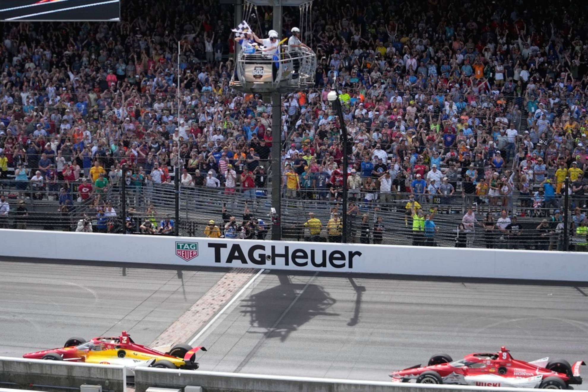 Josef Newgarden takes the checkered flag ahead of Marcus Ericsson to win the Indianapolis 500 auto race
