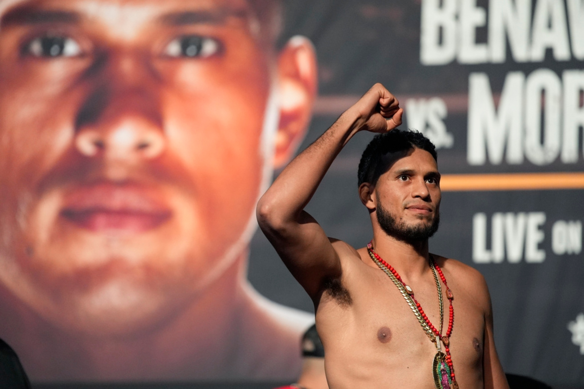 David Benavidez motions to the crowd during a ceremonial weigh-in for a light heavyweight title fight against David Morrell Jr.