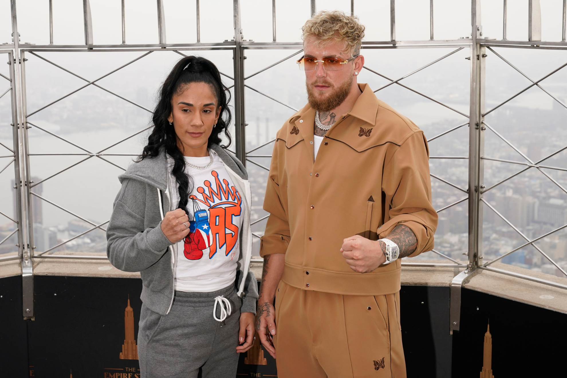 Jake Paul and Amanda Serrano pose for a promotional photo before her fight against Katie Taylor.