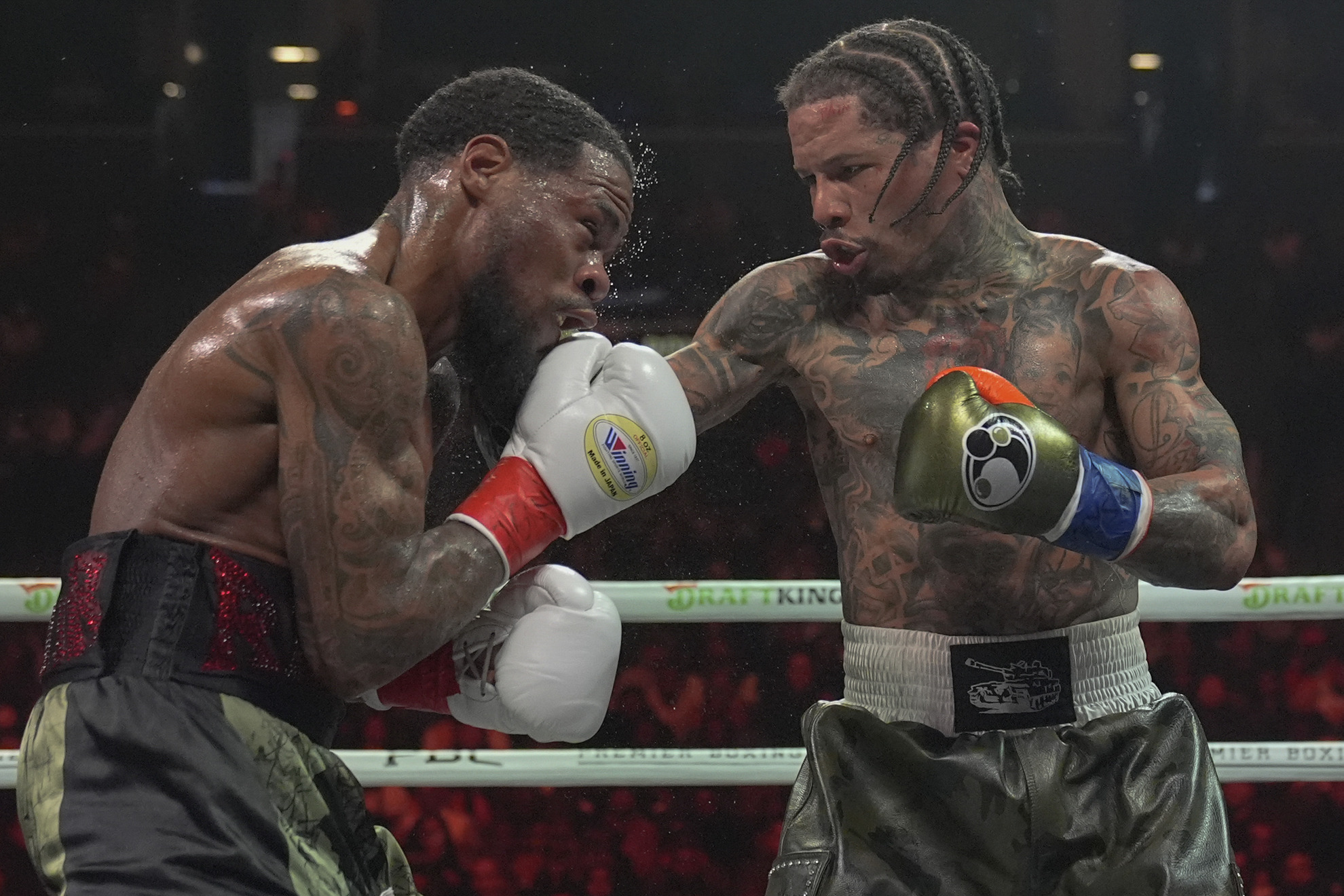 Gervonta Davis, right, punches Lamont Roach