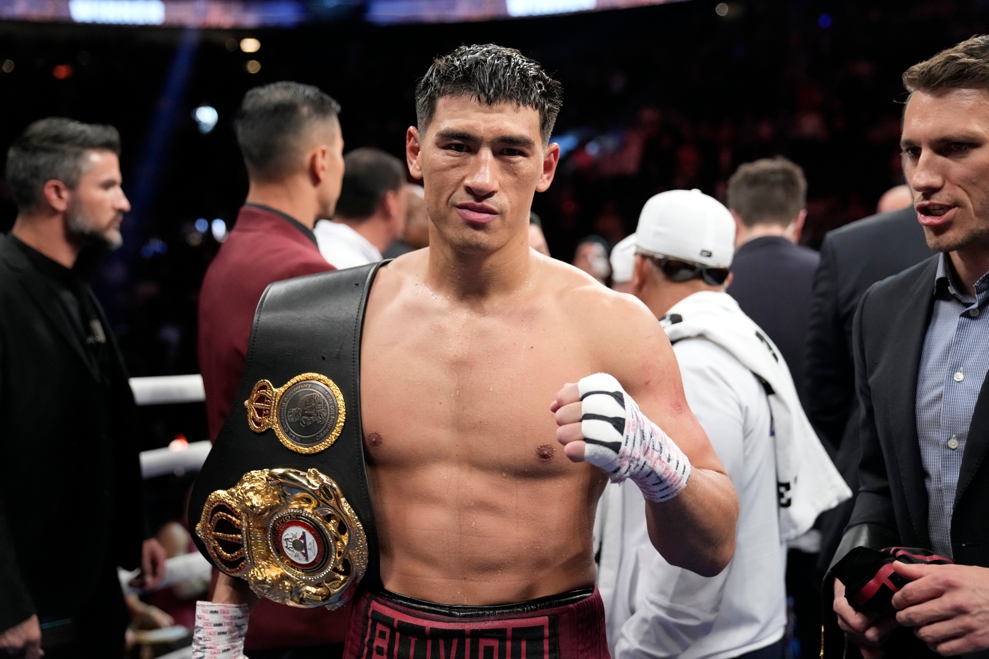 Dmitry Bivol celebrates after winning a light heavyweight title boxing match against Canelo Alvarez in 2022.