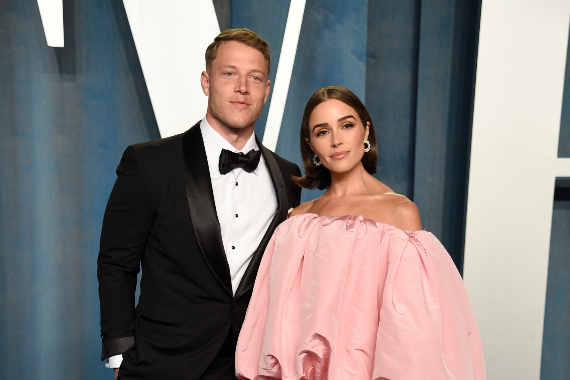 Christian McCaffrey and Olivia Culpo arrive at the 2022 Vanity Fair Oscar Party.