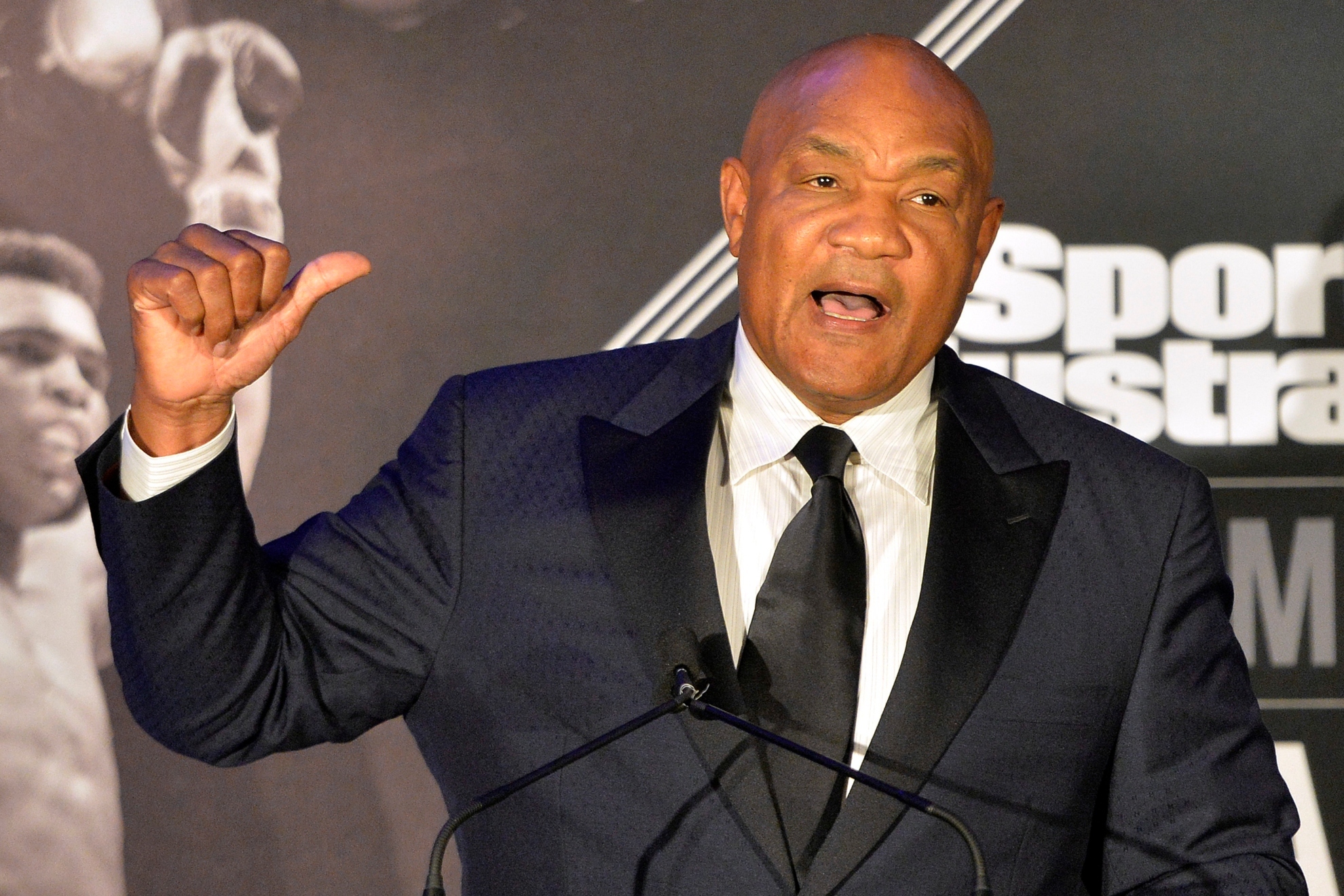 Former heavyweight boxing champion George Foreman tells a story to the audience at the Sports Illustrated Legacy Awards in 2015.