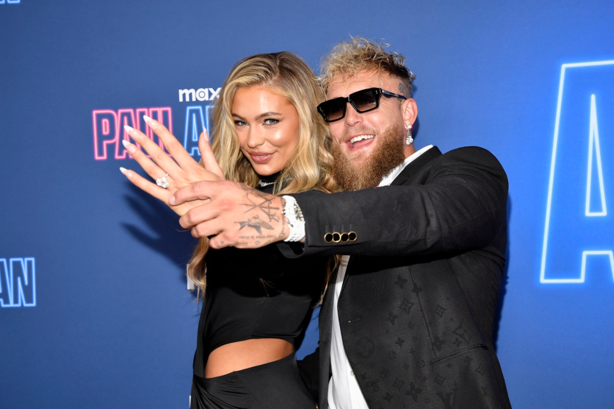 Jake Paul, right, and fiancé Jutta Leerdam attend the Max Original reality series premiere of "Paul American" at the Tempo by Hilton Times Square.