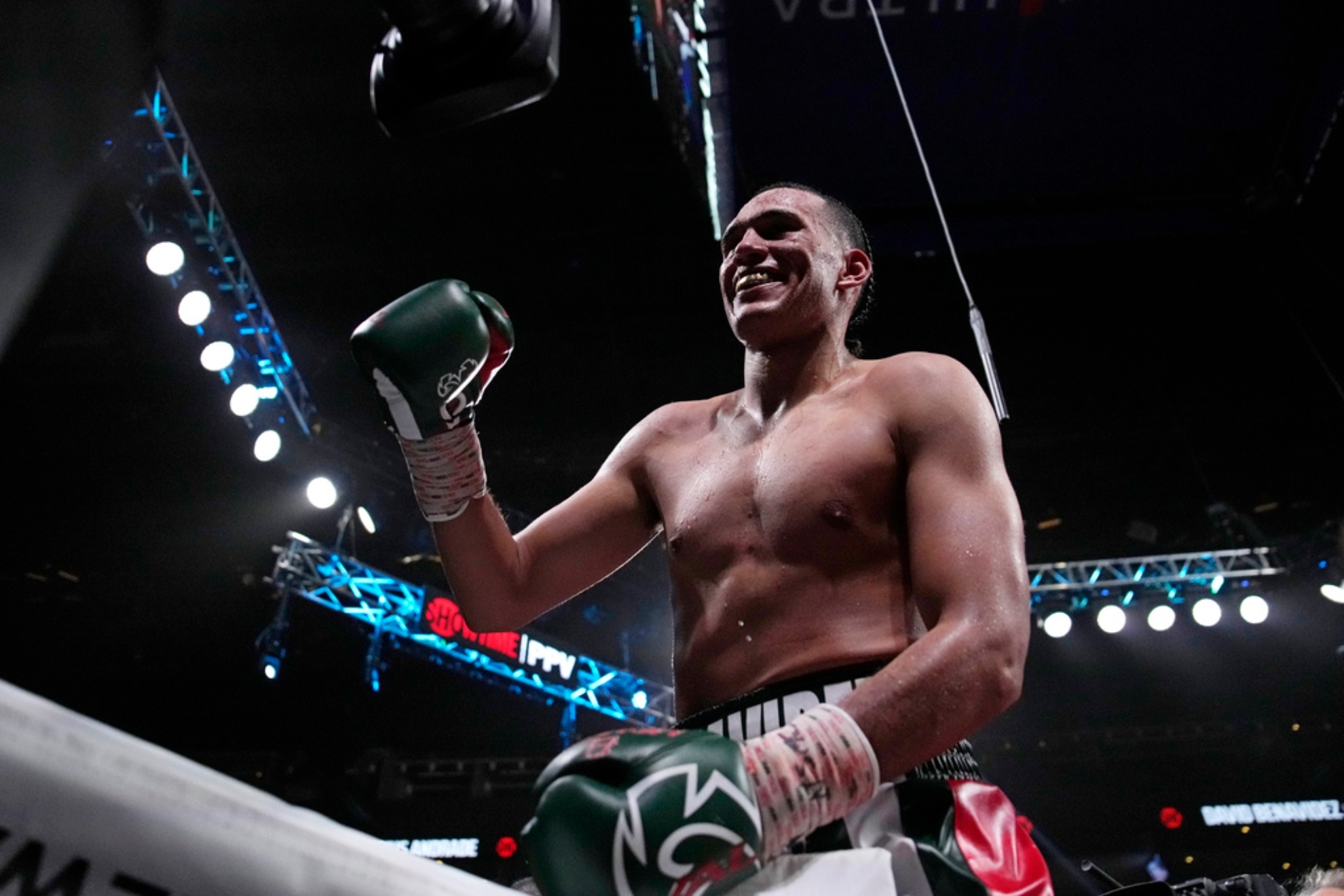 David Benavidez smiles after defeating Demetrius Andrade in a super middleweight boxing match.