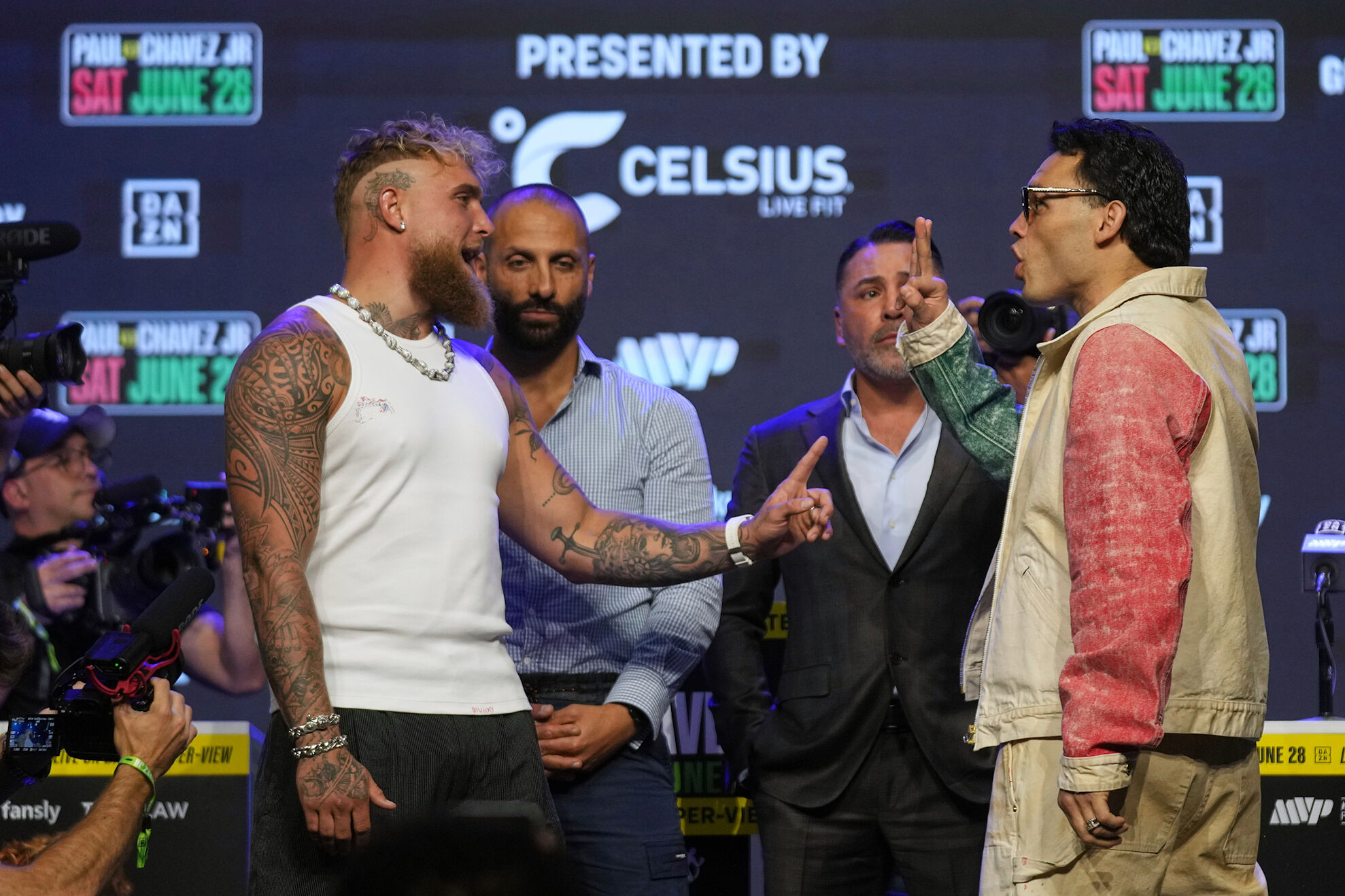 Jake Paul threatens Canelo Alvarez while mocking Julio César Chávez Jr. before stepping into the ring.
