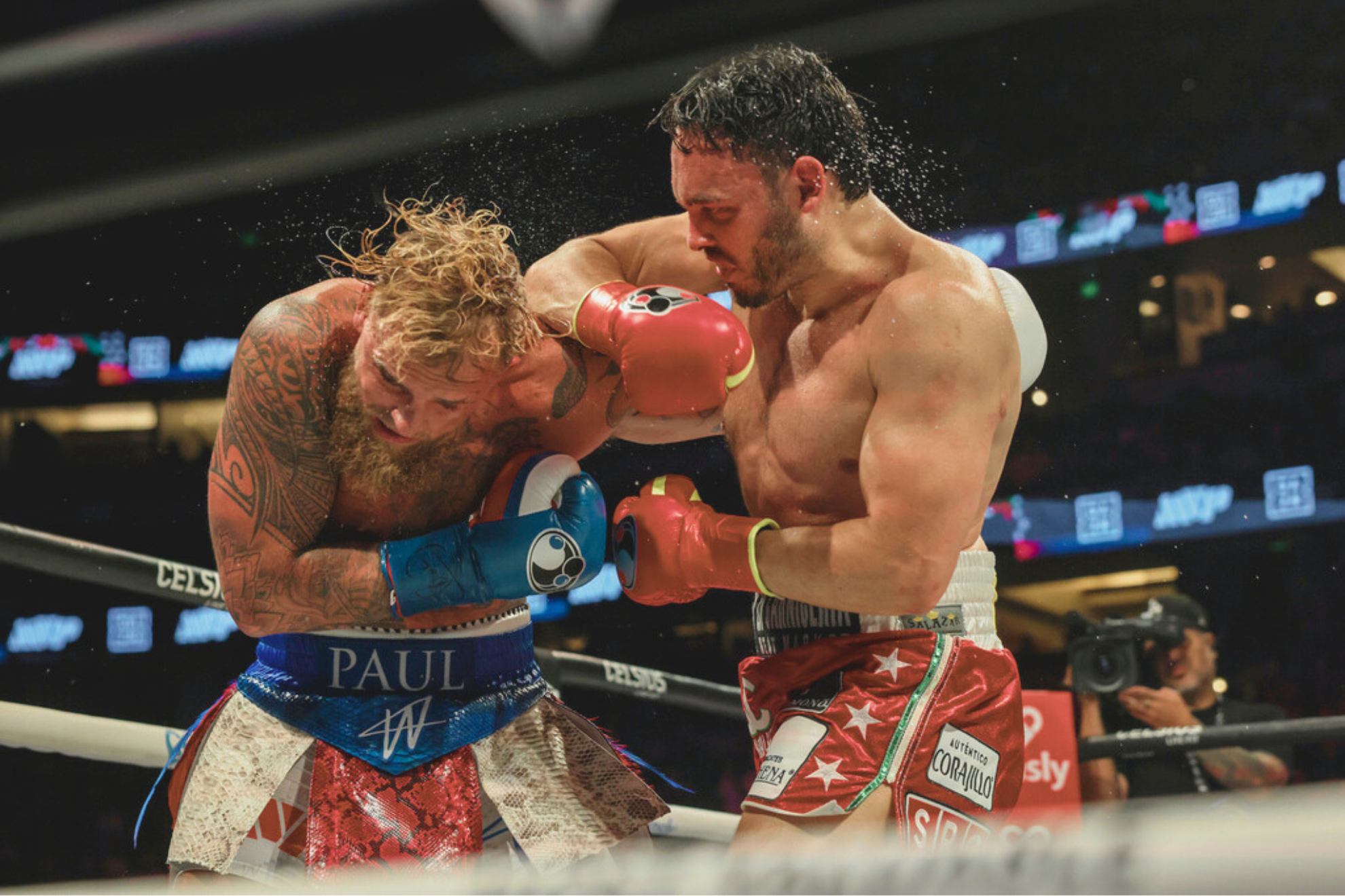 Julio Cesar Chavez Jr., right, punches Jake Paul during their cruiserweight boxing.