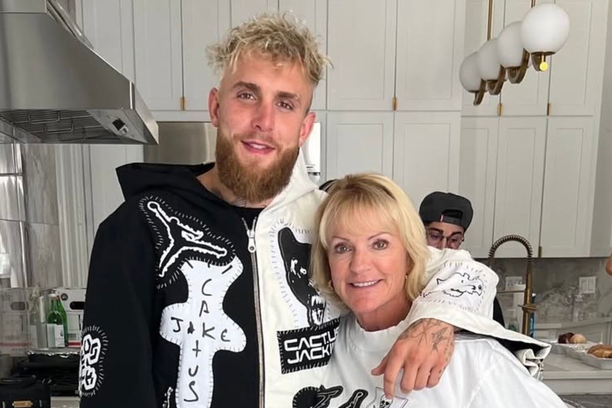 Jake Paul's mom gets rowdy on the DJ booth mimicking his boxing moves while celebrating his latest win