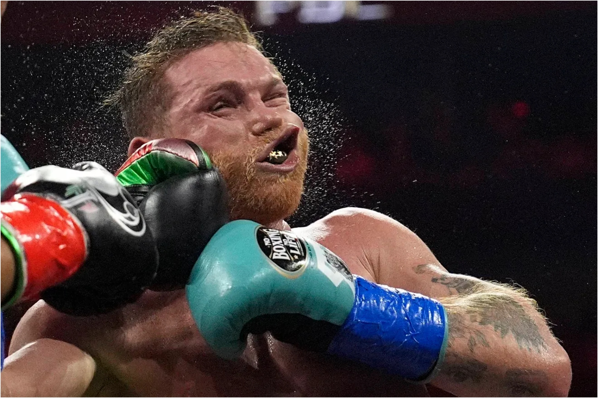 Canelo Alvarez takes a punch during a fight.