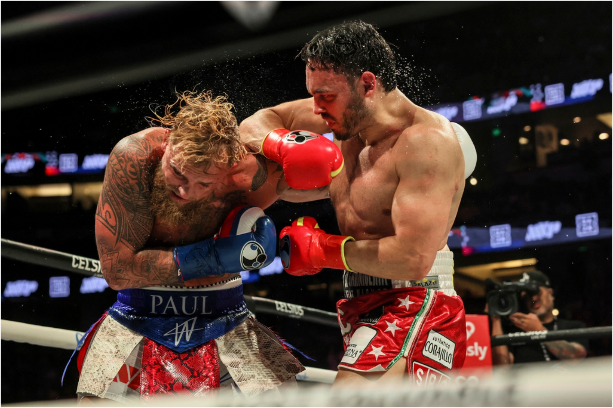 Julio Cesar Chavez Jr., right, punches Jake Paul during their cruiserweight boxing match.