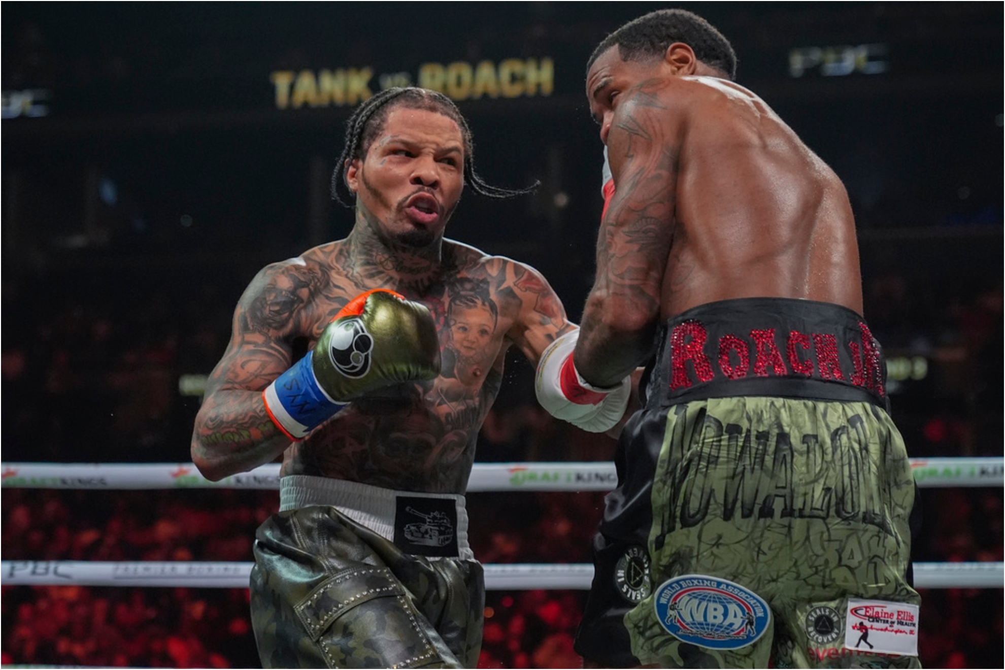 Gervonta Davis, left, punches Lamont Roach during the third round of a WBA lightweight championship boxing.