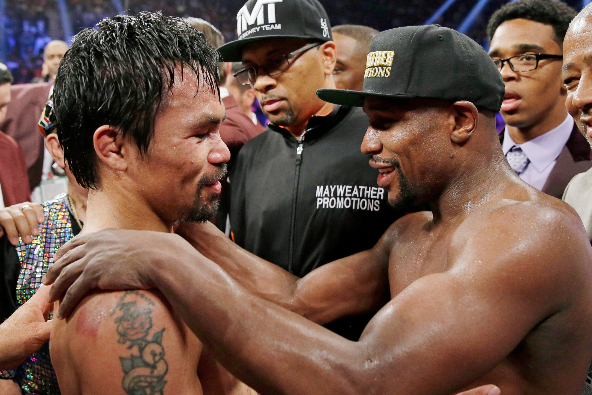Manny Pacquiao and Floyd Mayweather Jr. greet each other in the ring after their 2015 fight.