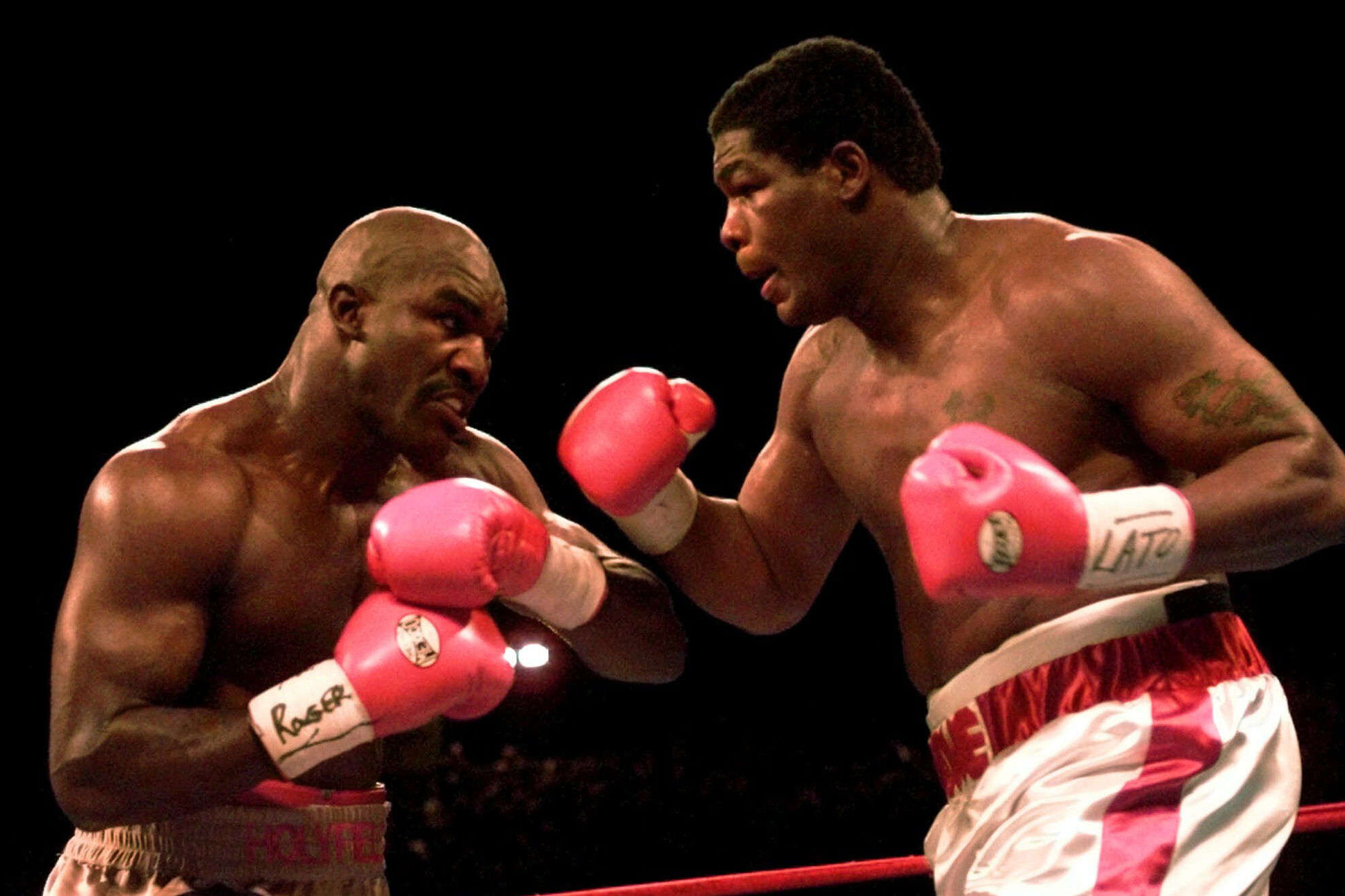 Heavyweights Evander Holyfield, left, and Riddick Bowe battle in the third round of their fight Saturday, Nov. 4, 1995, at Caesars Palace in Las Vegas.