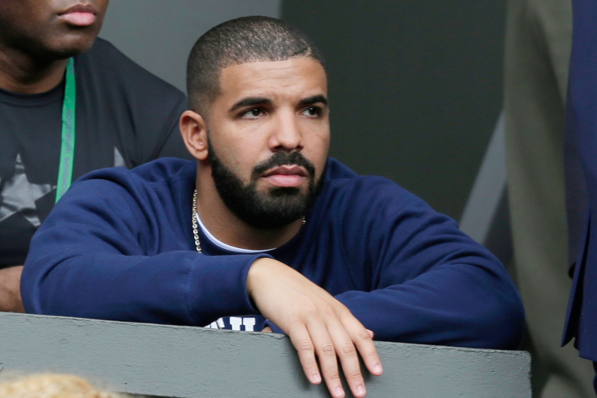 Aubrey Graham at a tennis game that he bet on and lost.