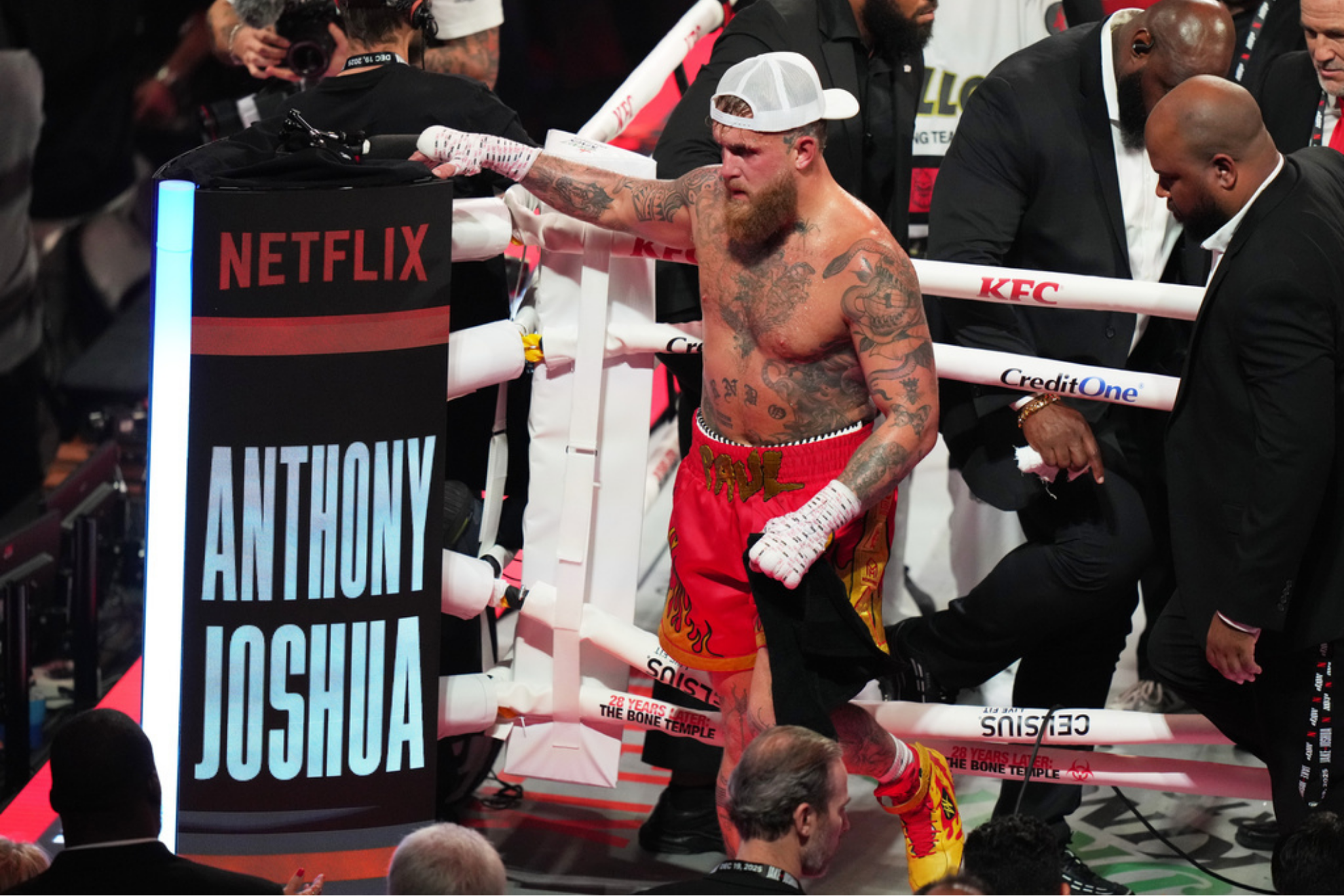 Jake Paul, left, walks from the ring after his heavyweight boxing match against Anthony Joshua