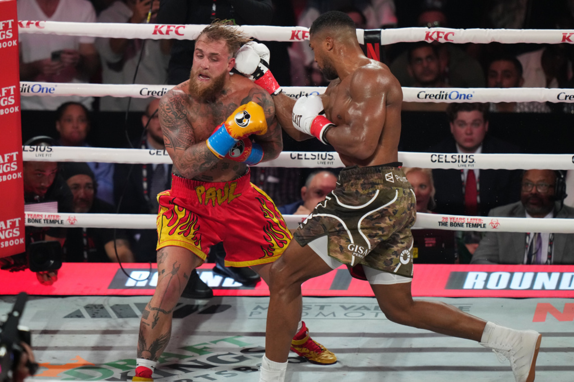 Anthony Joshua, right, punches Jake Paul during their heavyweight boxing match