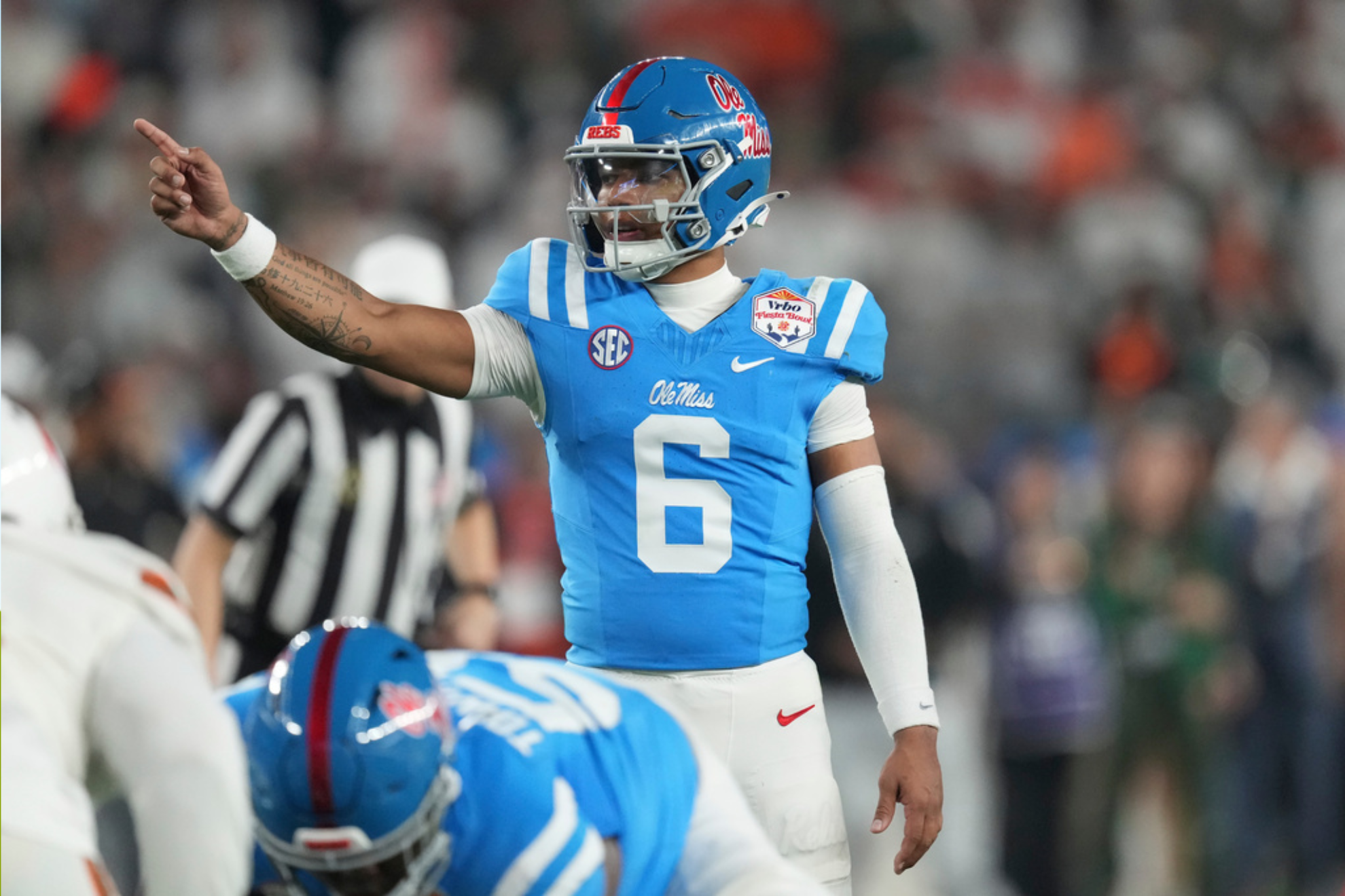 Mississippi quarterback Trinidad Chambliss signals to teammates during the second half of the Fiesta Bowl NCAA college football playoff semifinal game