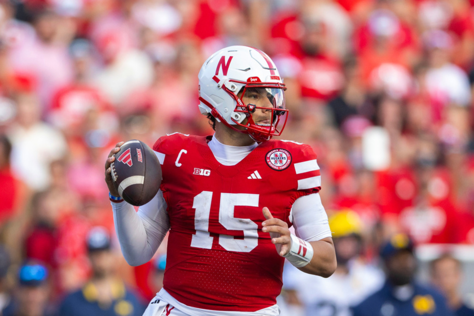 Nebraska quarterback Dylan Raiola (15) sets up a play against Michigan during the second half of an NCAA college football game