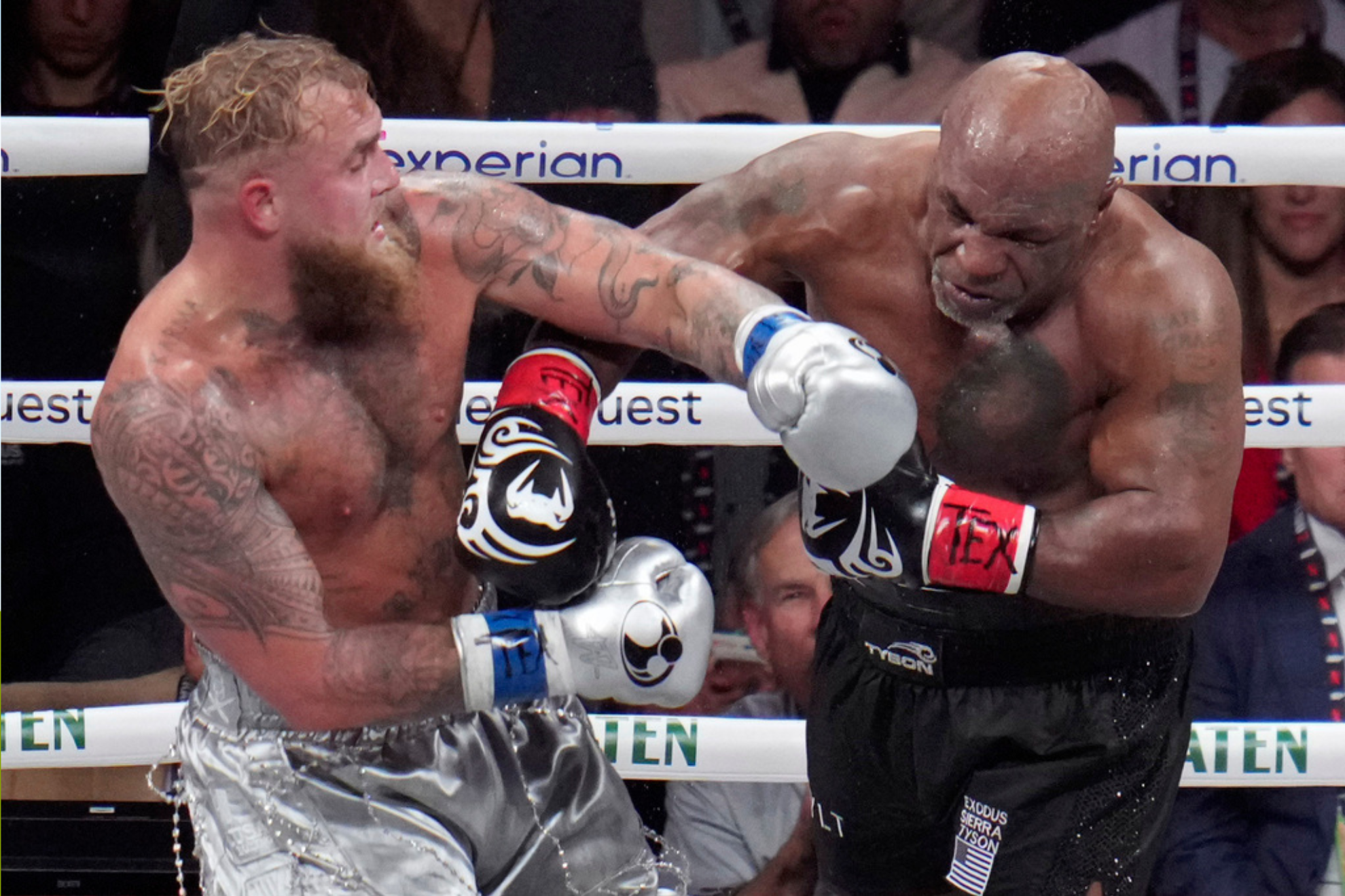 Jake Paul, left, fights Mike Tyson during their heavyweight boxing match