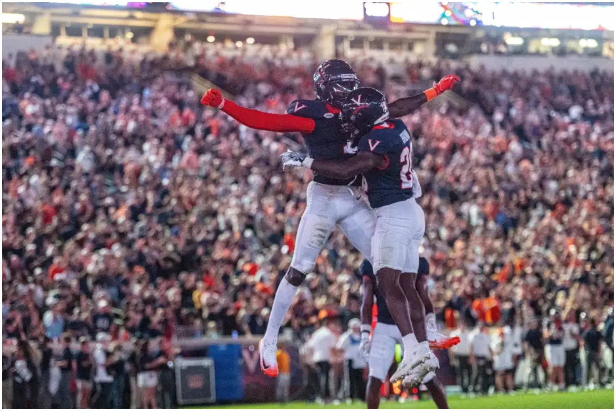 Virginia running back Xavier Brown (20) Virginia wide receiver Andre Greene Jr. (2) celebrate after a touchdown during the second half of an NCAA college football game