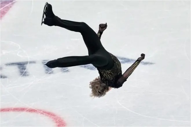 Malinin, in the backward somersault.