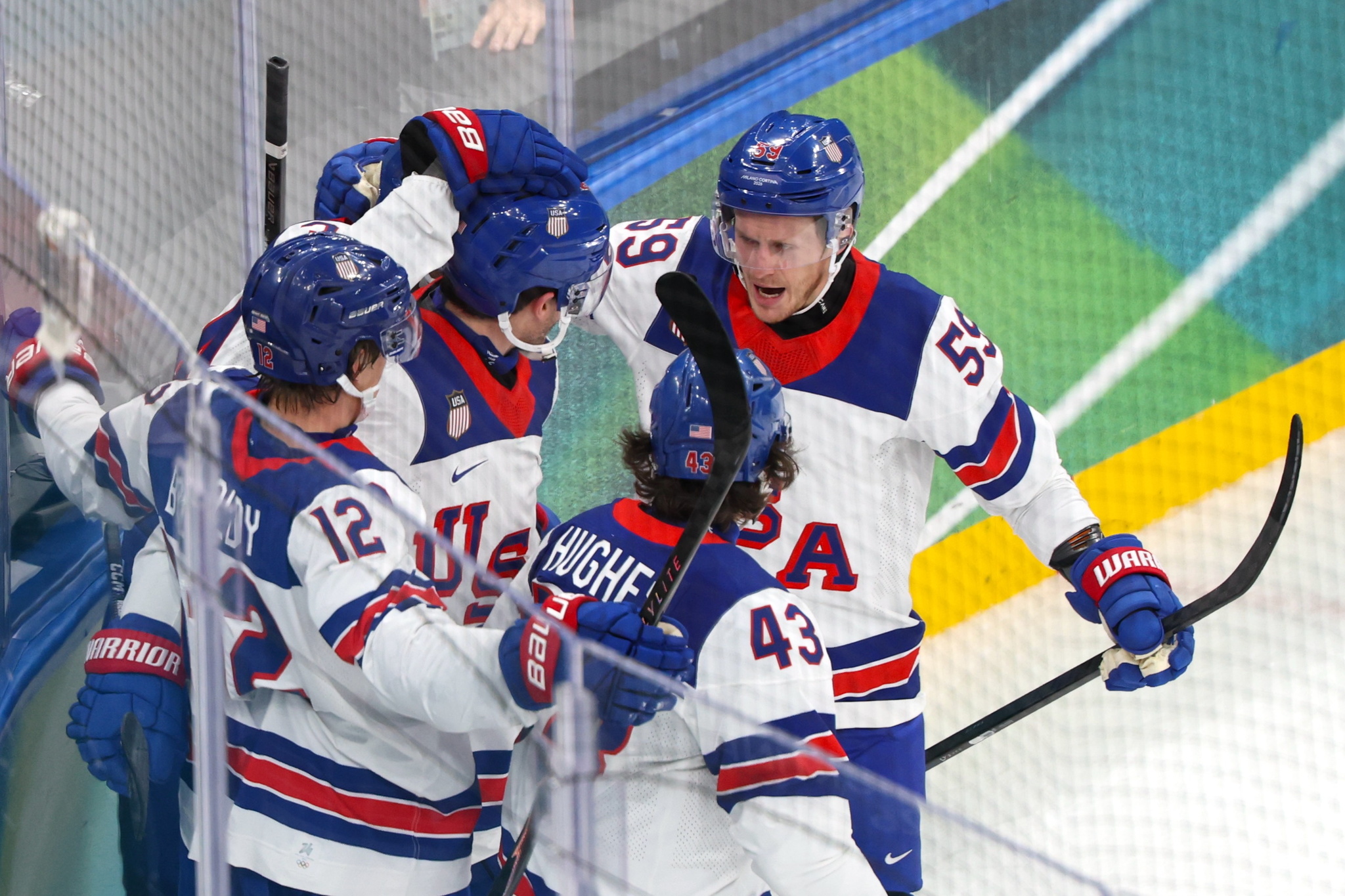 Team USA celebrate scoring a goal during the Men's Preliminary Round match at the Winter Olympics